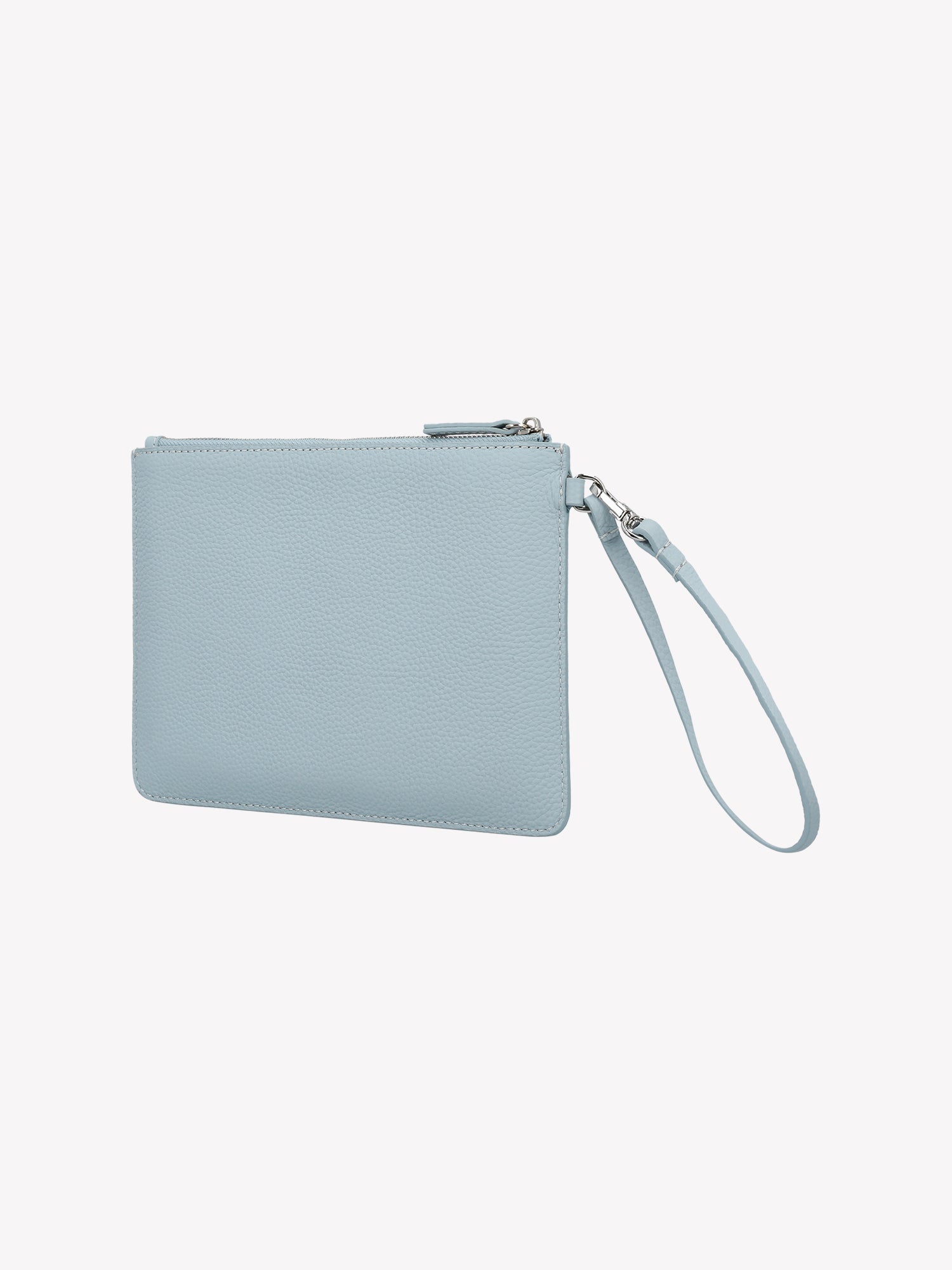 Nanso light blue Naru Pieni Bag works as both a wallet and a small bag. The bag's short strap can also be attached to a larger Naru bag's strap.
The bag features a metal zipper and the Nanso logo is printed on the front. Product picture from the back.