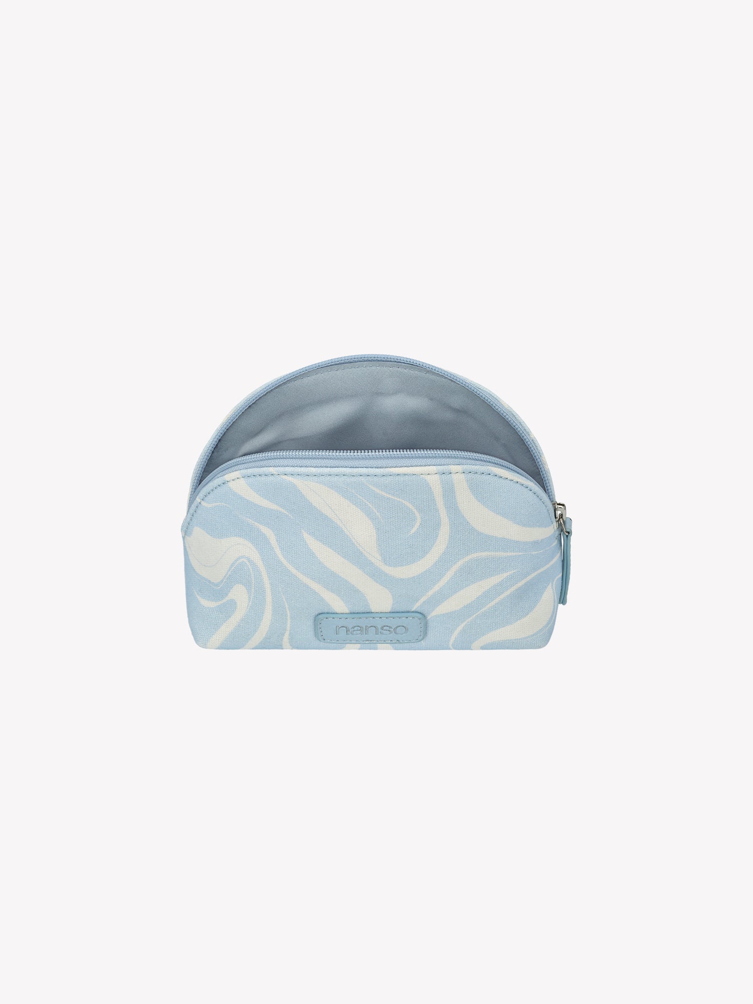 The VESI MINI Cosmetics Bag in blue in a product picture, zipper opened.