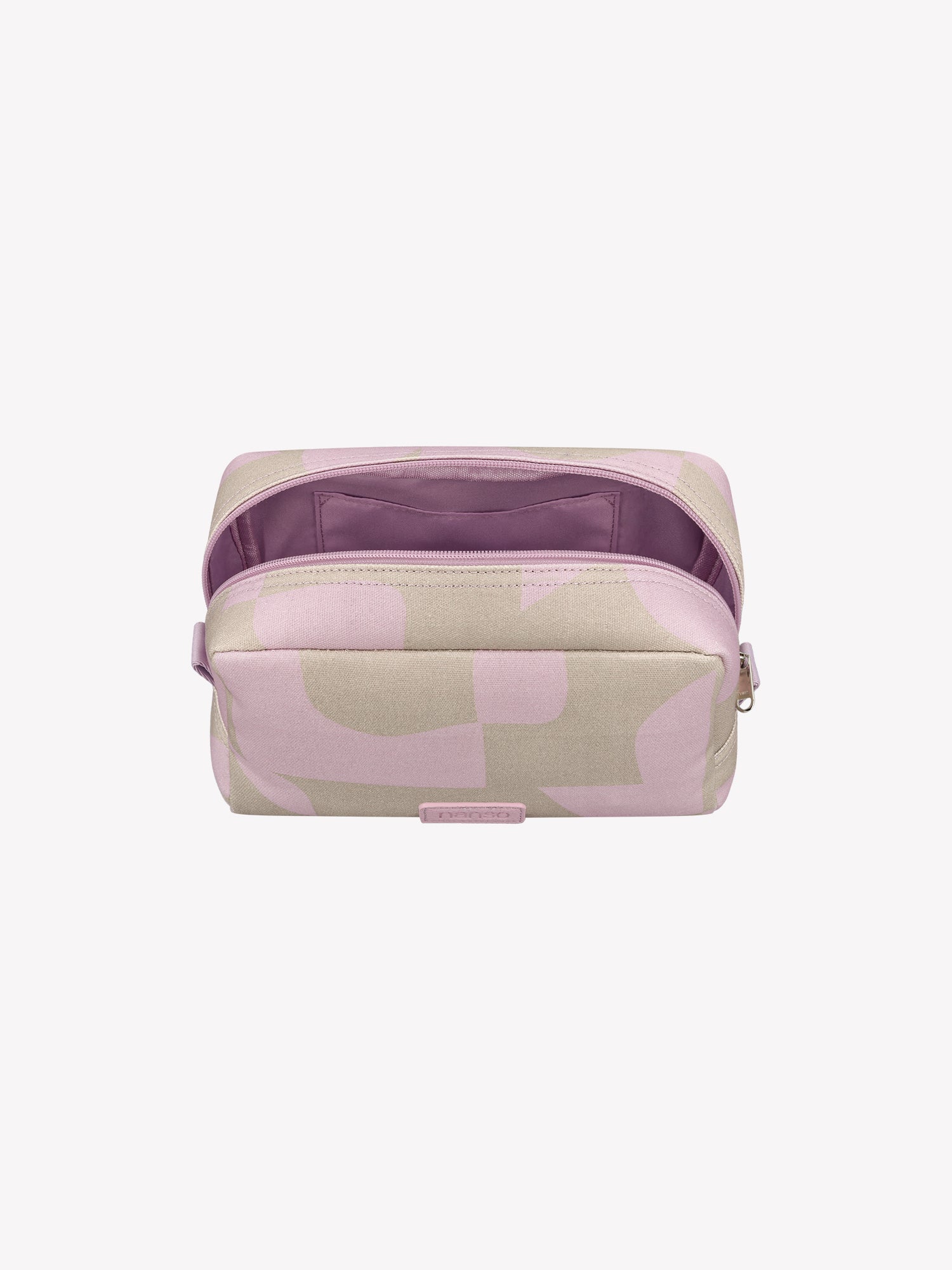 The KALLIO cosmetics bag features a stylish two-tone design that combines beige and pink hues. Product picture from the above zipper opened.
