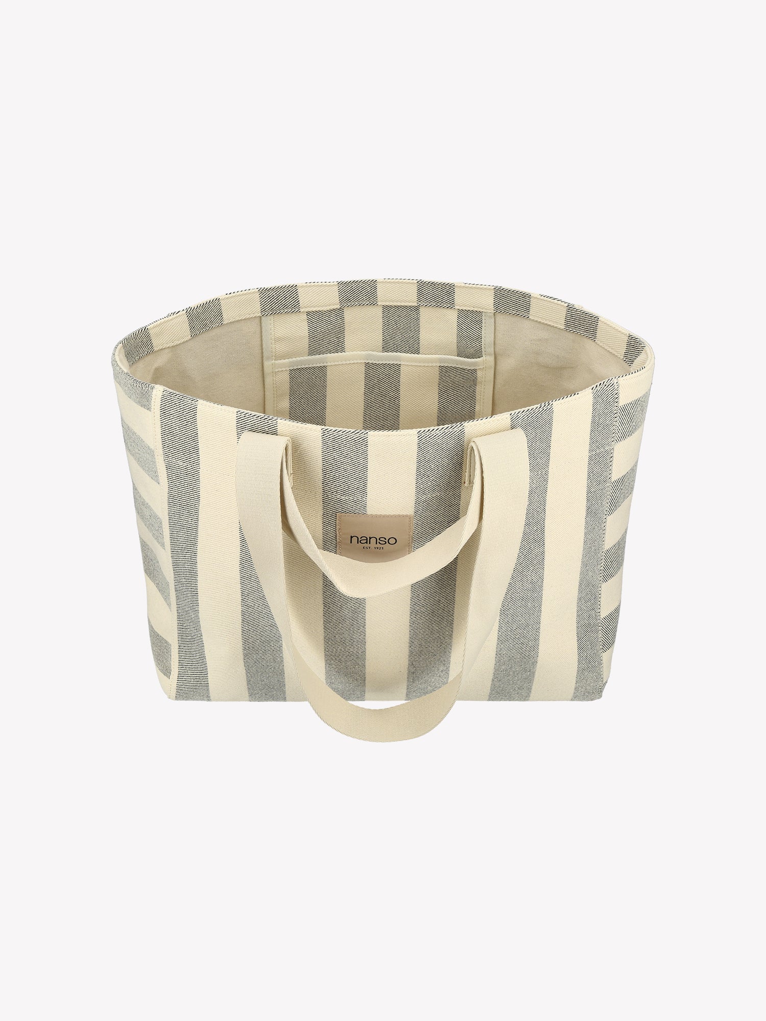 The Amalfi Beach bag brings effortless style to your adventures with its crisp black and white striped design.  Product picture from above.