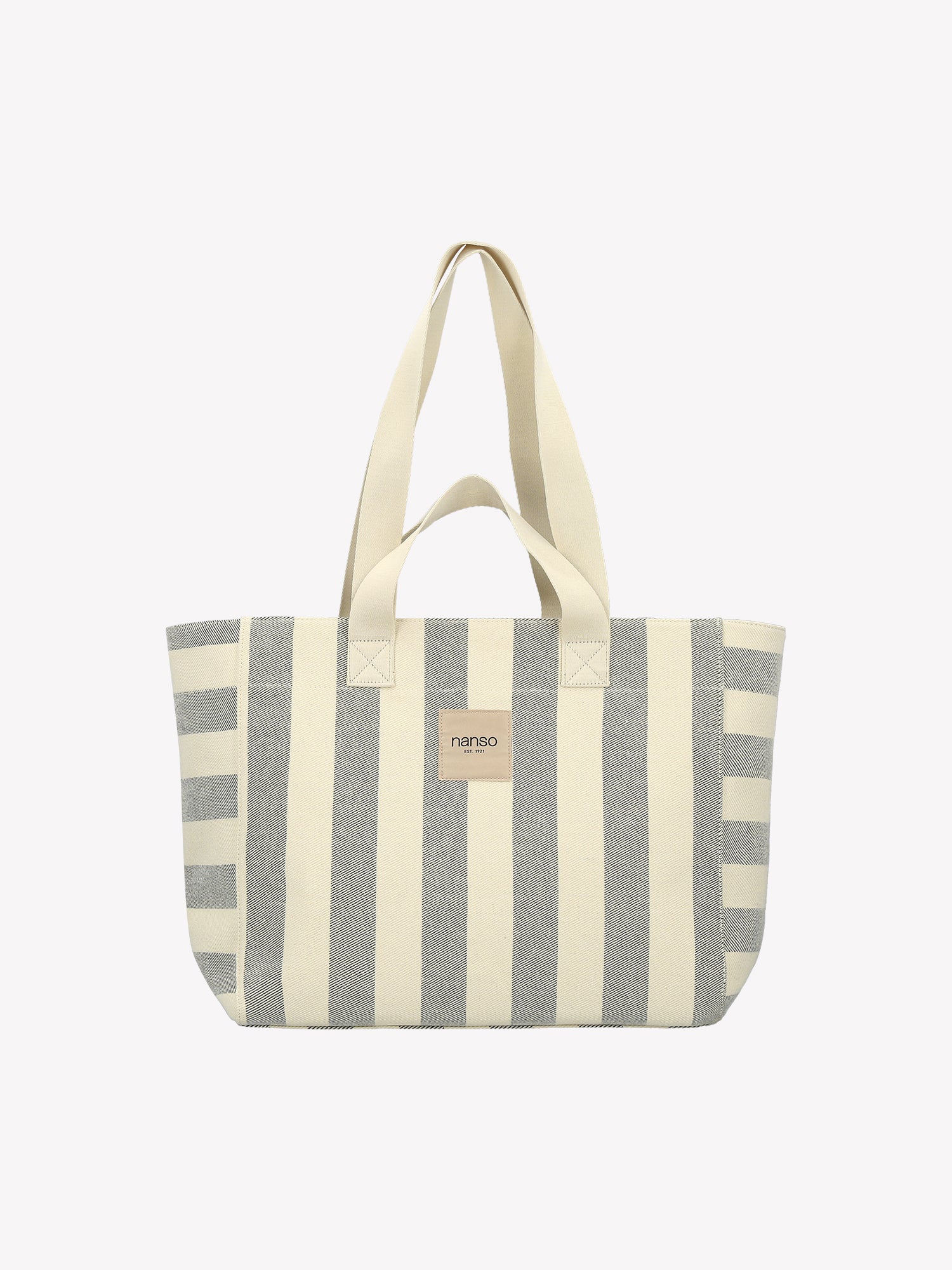 The Amalfi Beach bag brings effortless style to your adventures with its crisp black and white striped design.  Product picture.