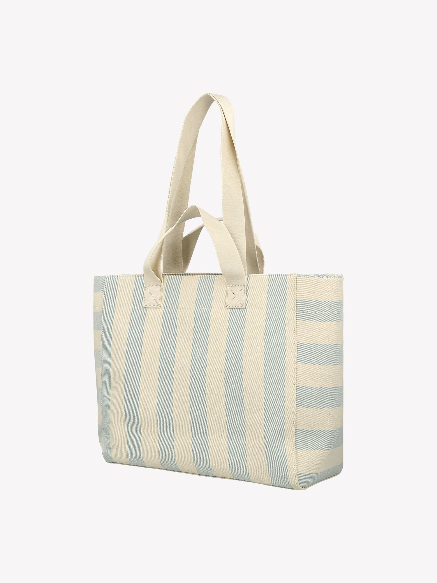 The Amalfi Beach bag brings effortless style to your adventures with its crisp light blue and white striped design. Crafted from durable fabric with dual handles. Product picture from the backside.