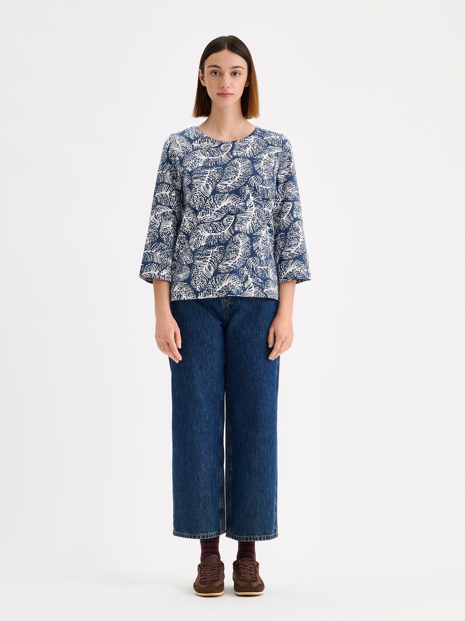 Nanso women's patterned Pieni Hilde jersey blouse is stylish and clean-lined in design with 3/4 sleeves, small side slits and a round neckline. Pictured on a model with wide jeans