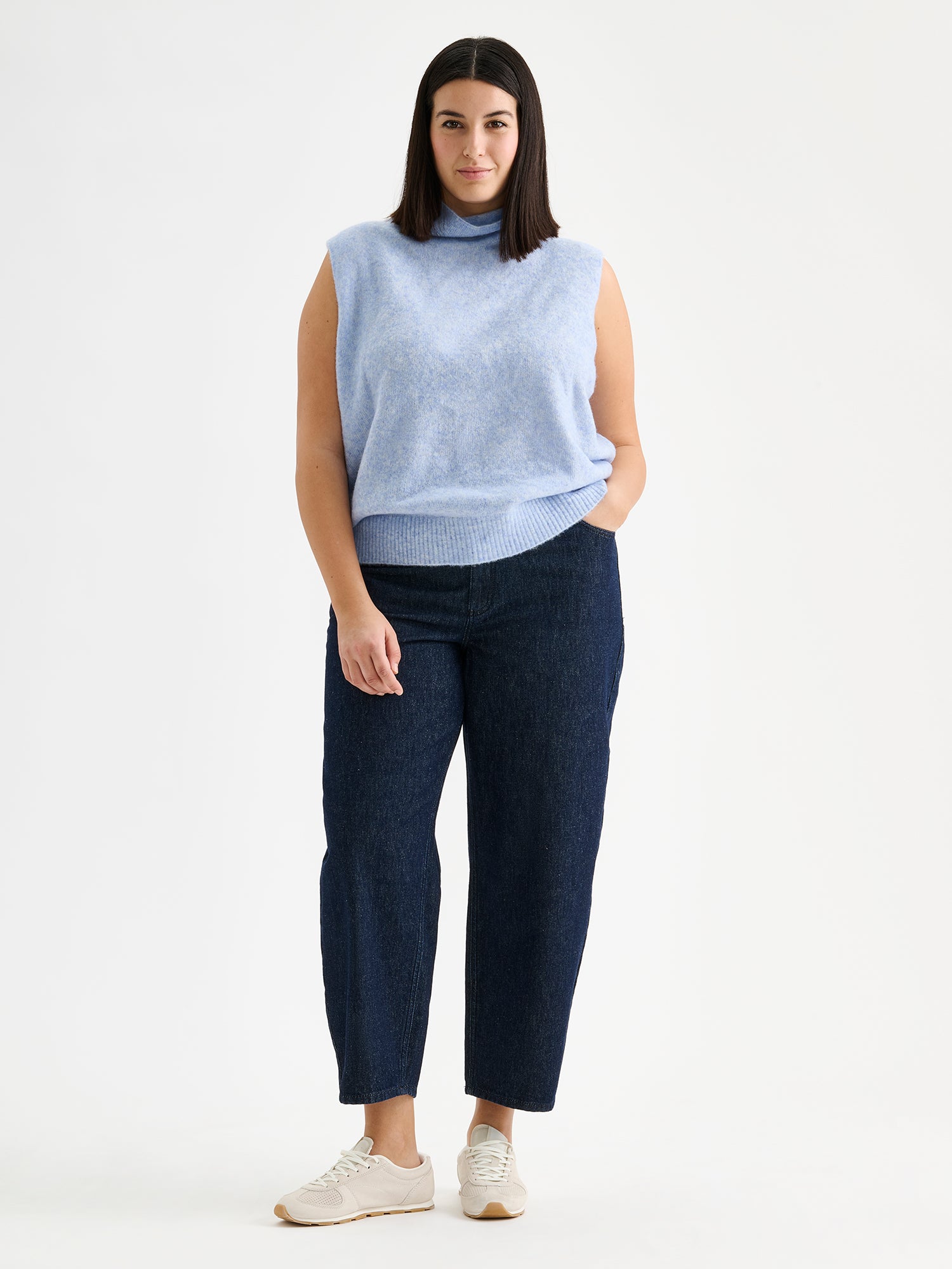 Nanso women's relaxed and wonderfully lightweight Alina knit vest with a high neckline on a model with blue jeans and sneakers | XL - 178cm