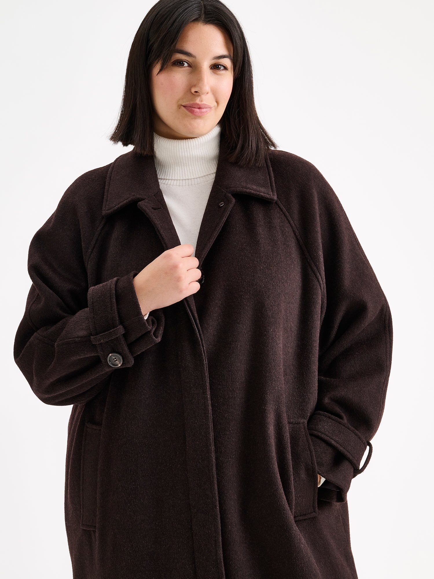 Nanso women's timelessly elegant and effortlessly classic, the Tove long wool coat, on a model with blue jeans