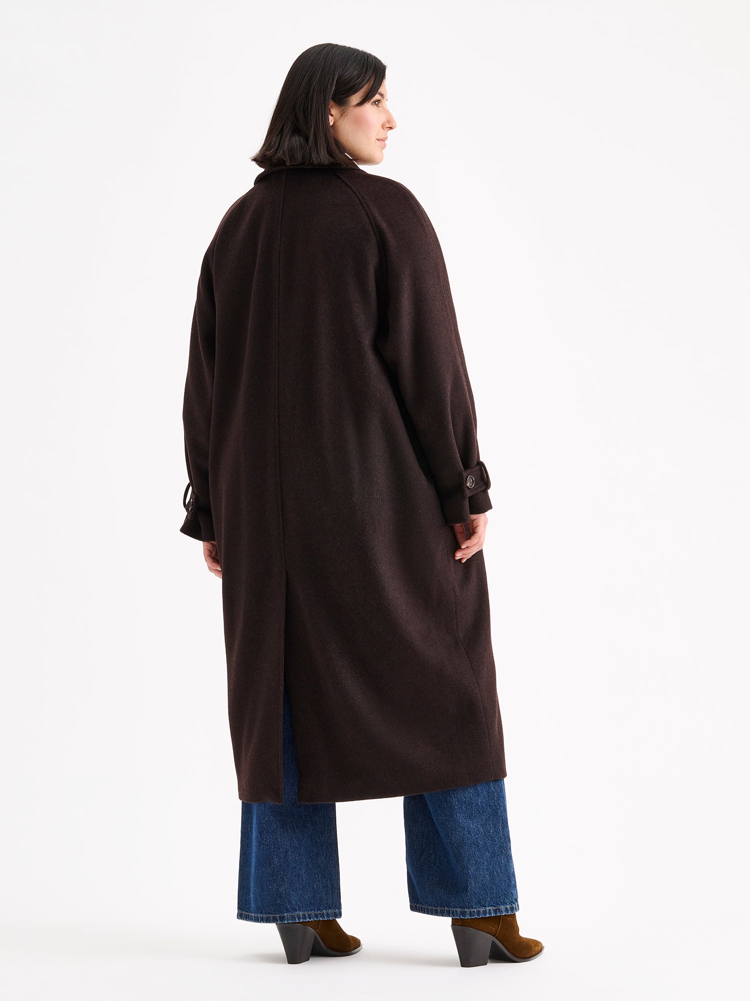 Nanso women's timelessly elegant and effortlessly classic, the Tove long wool coat, on a model with blue jeans from the backside