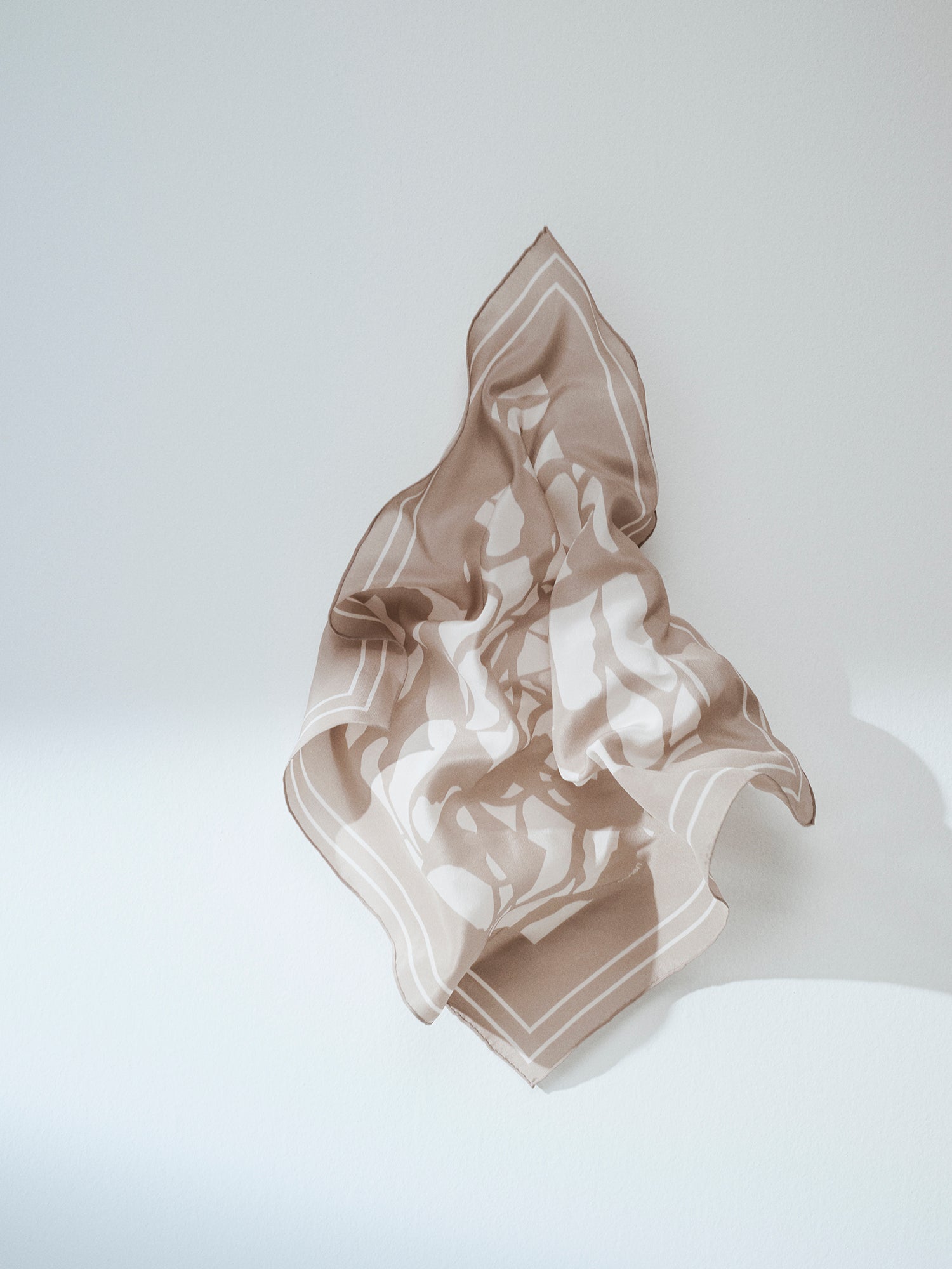 Palsta sophisticated patterned silk scarf in a product picture.