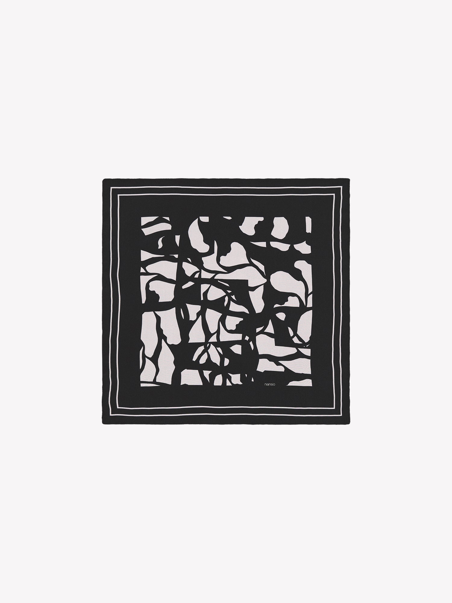 Palsta sophisticated patterned silk scarf in black and white in a product picture.
