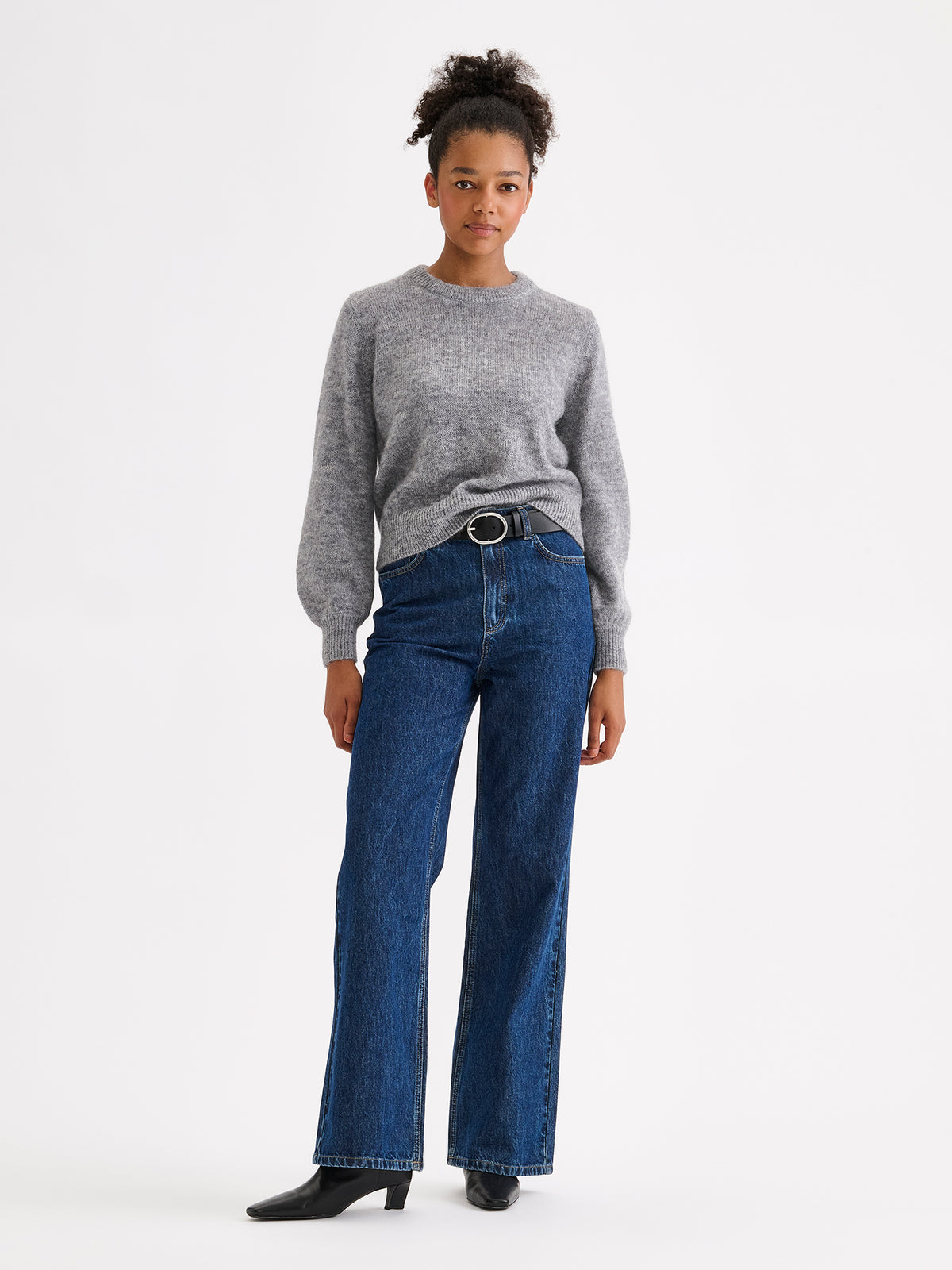Nanso women's Lotte knitted sweater in a timeless grey shade on a model with jeans | S - 177cm
