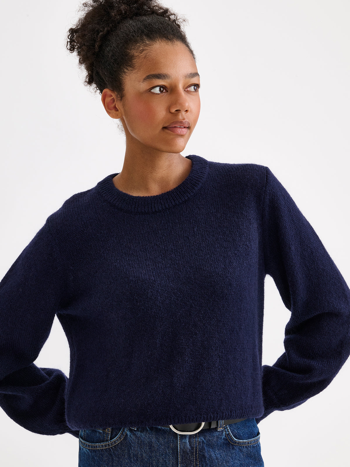 Nanso women's Lotte knitted sweater in a timeless blue shade on a model with jeans | S - 177cm