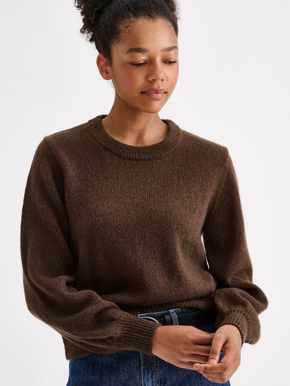 Nanso women's Lotte knitted sweater in a timeless brown shade on a model with jeans | S - 177cm