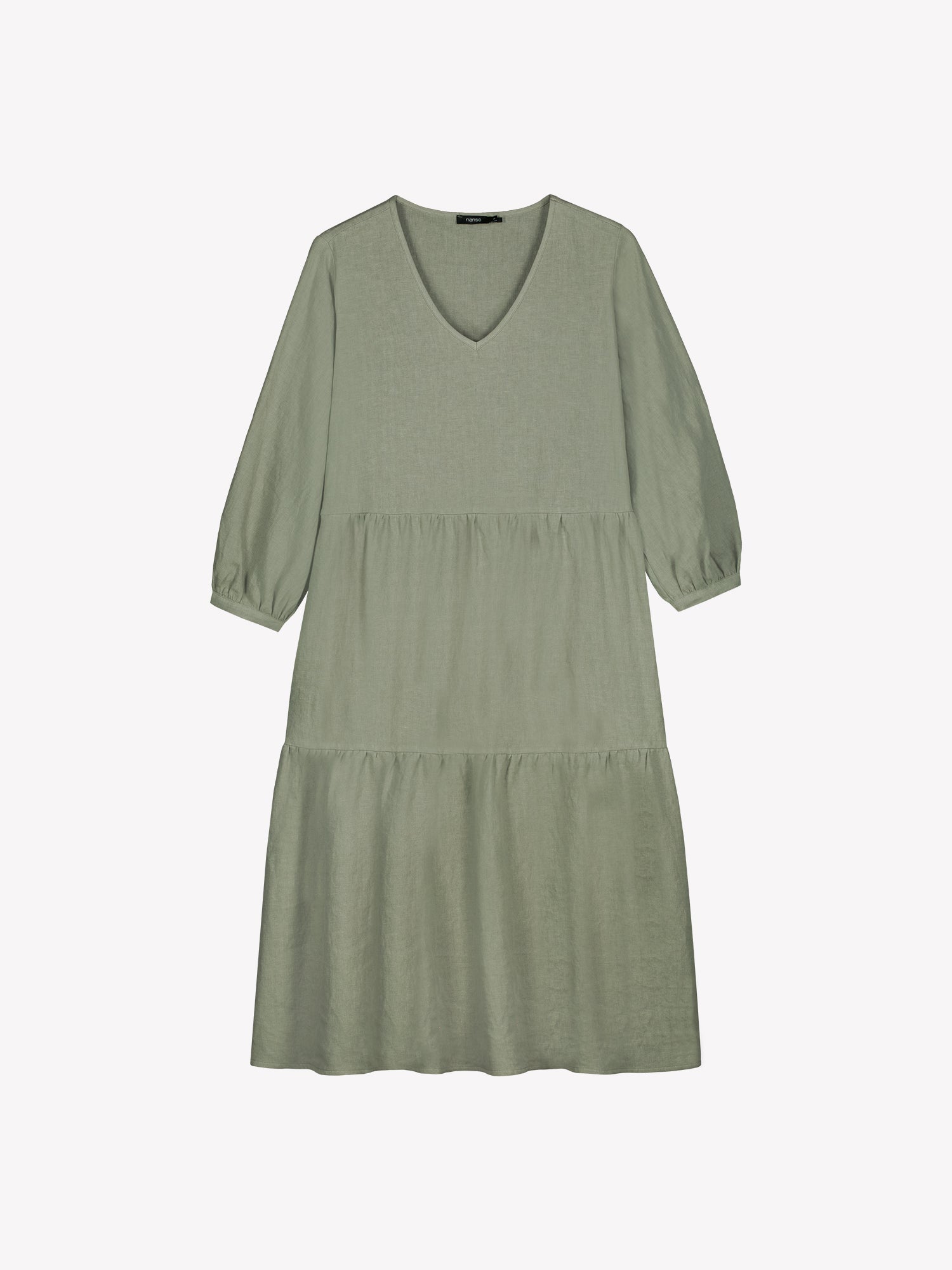 Nanso women's SARALIVIA linen dress in green features charming layered ruffles, 3/4 sleeves, side pockets and a V-neckline. Product picture from the front.