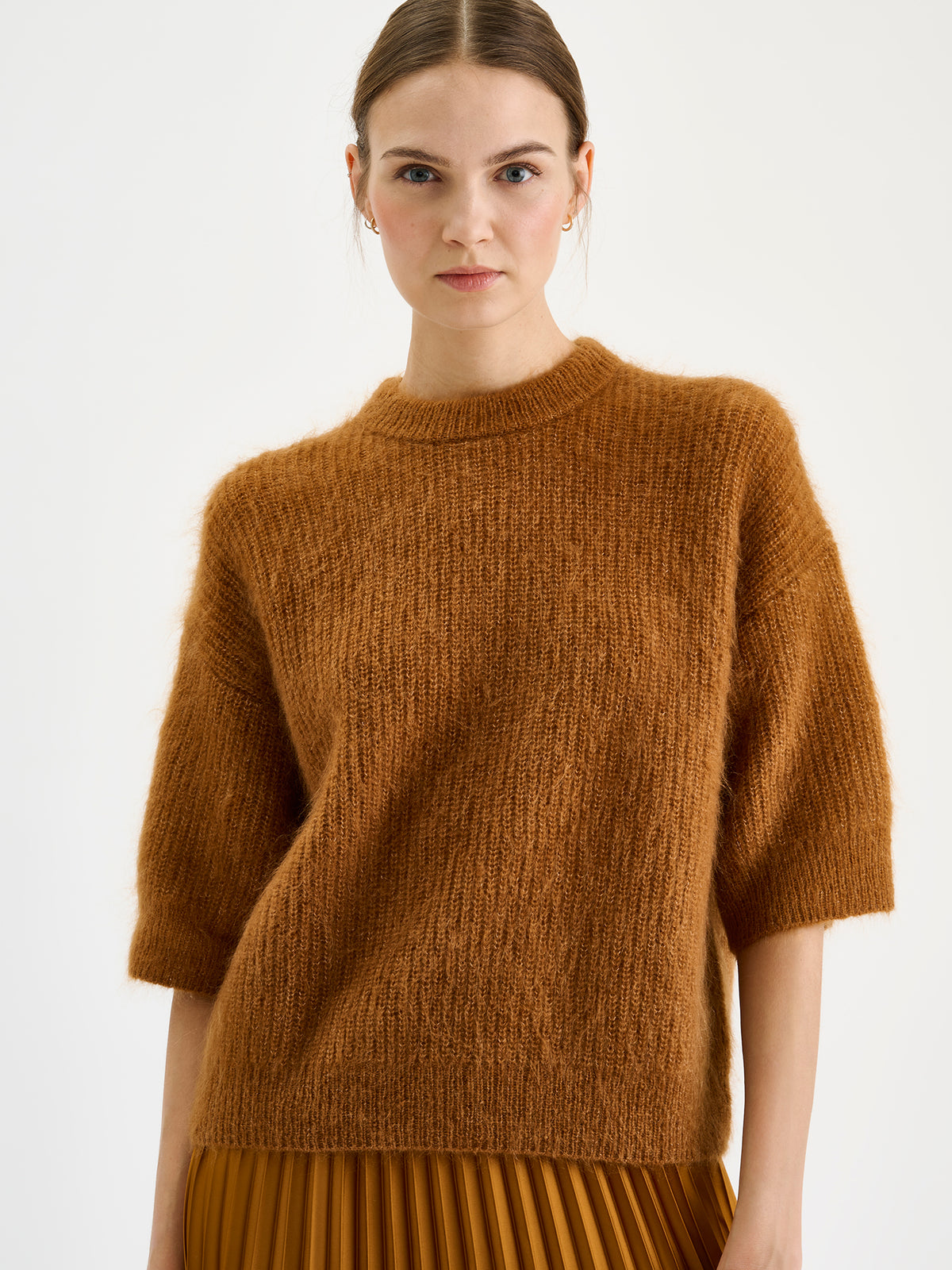 Nanso women's wonderfully warm and luxurious Sumi knitted sweater in rich brown and beautifully fluffy texture, on a model close up