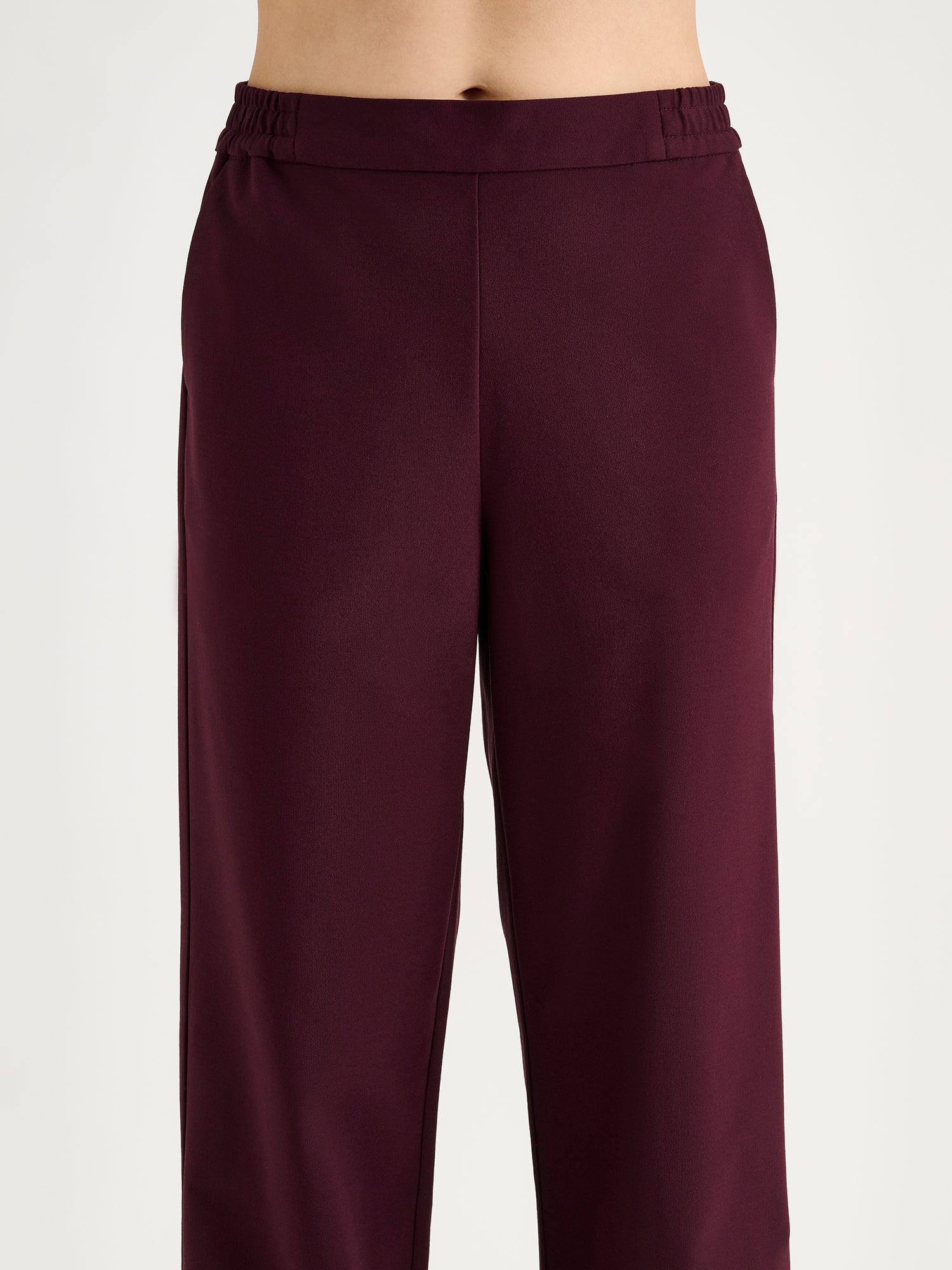 Nanso Women's Jonna wine red trousers on a model close-up.