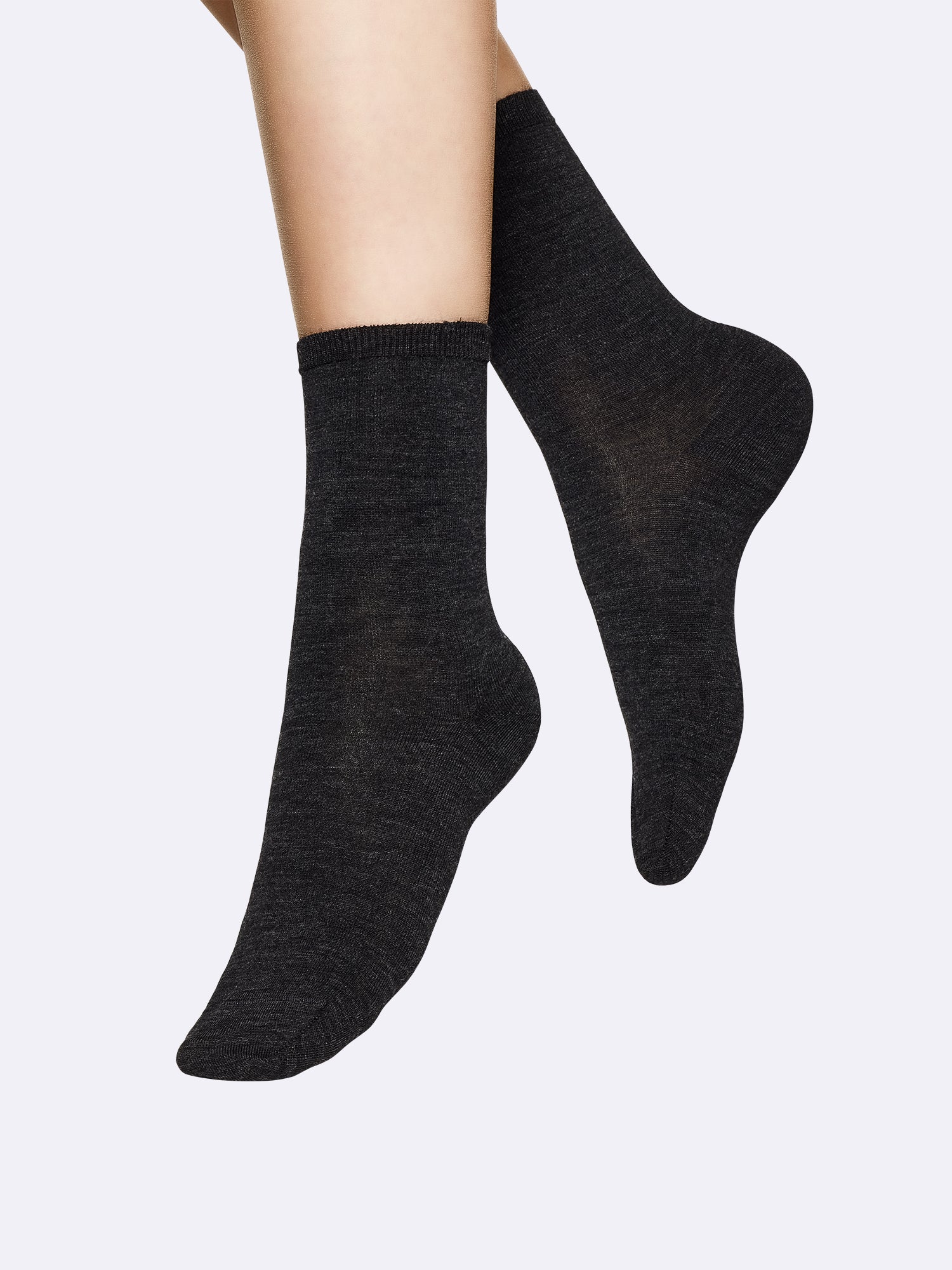 Vogue women's Merino Wool socks in shade asphalt crafted from premium merino wool, on a model.