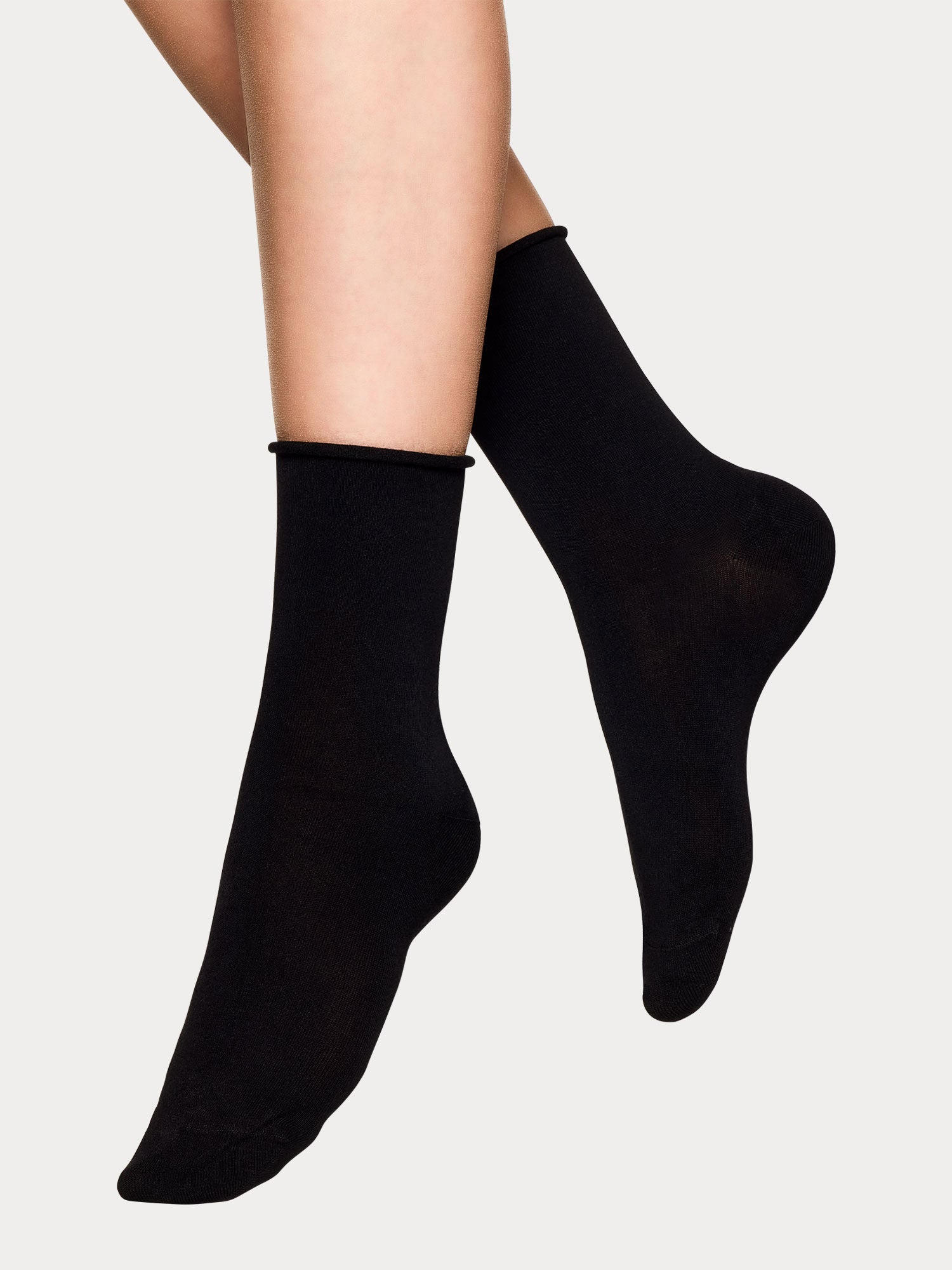 Vogue women's soft black bamboo ankle socks with breathable, temperature-regulating feel, pictured on a model.