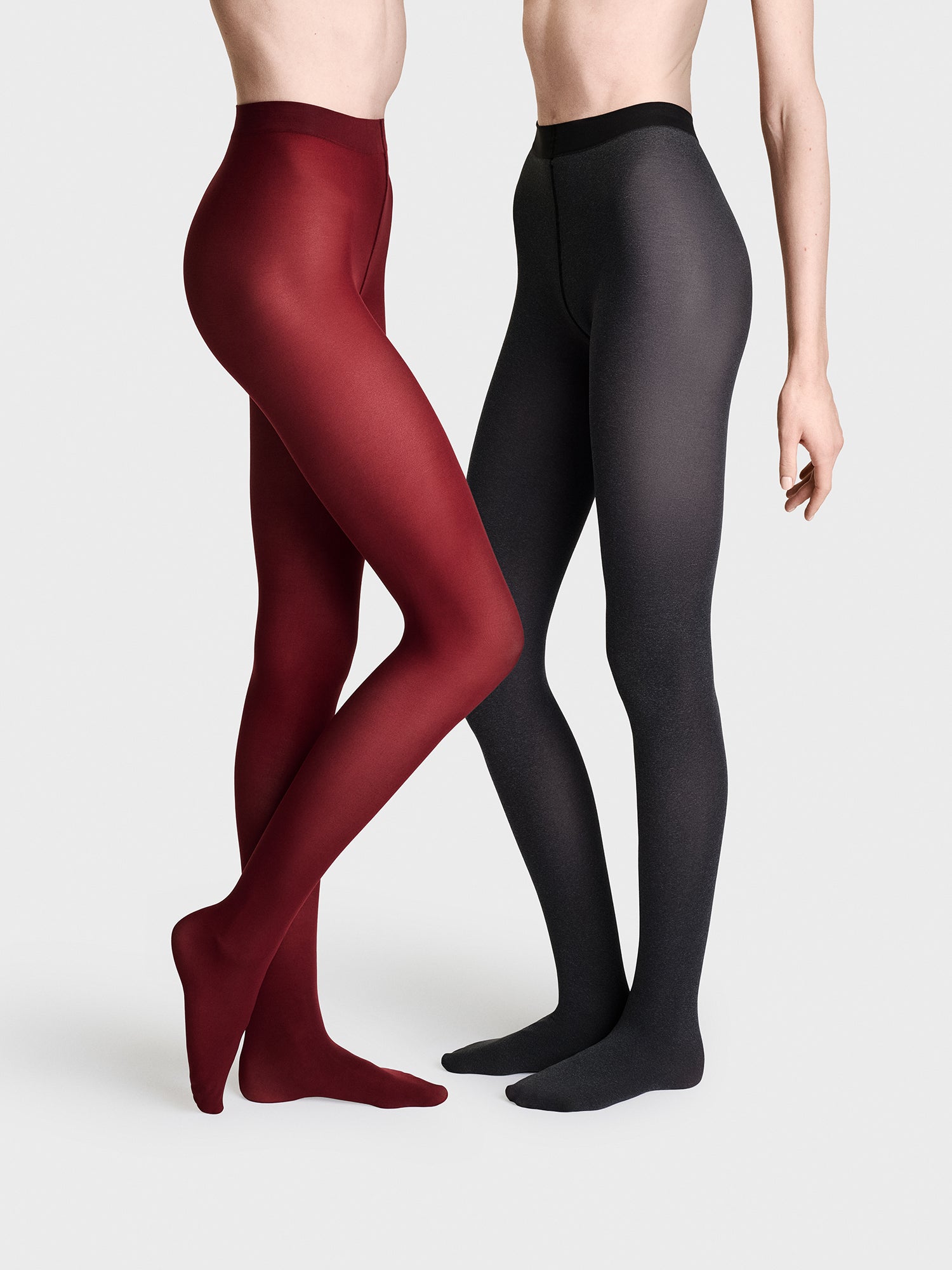 Vogue women’s 60 den matte tights in 2-pack in black and dark cherry. These opaque microfiber tights offer a soft, second skin feel and a fashionable matte finish. Product picture on 2 models