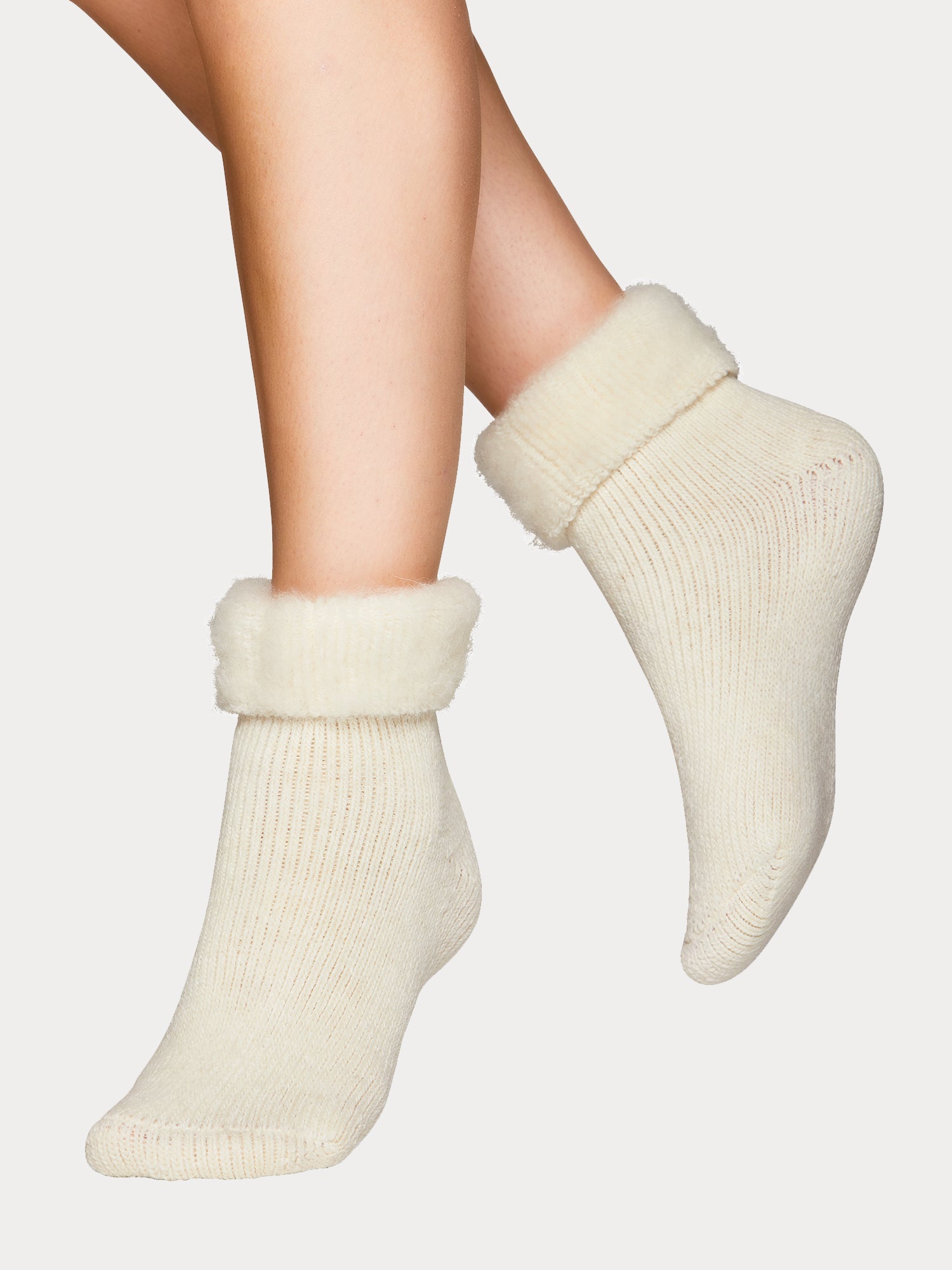 Vogue's Softies in off-white on a model.