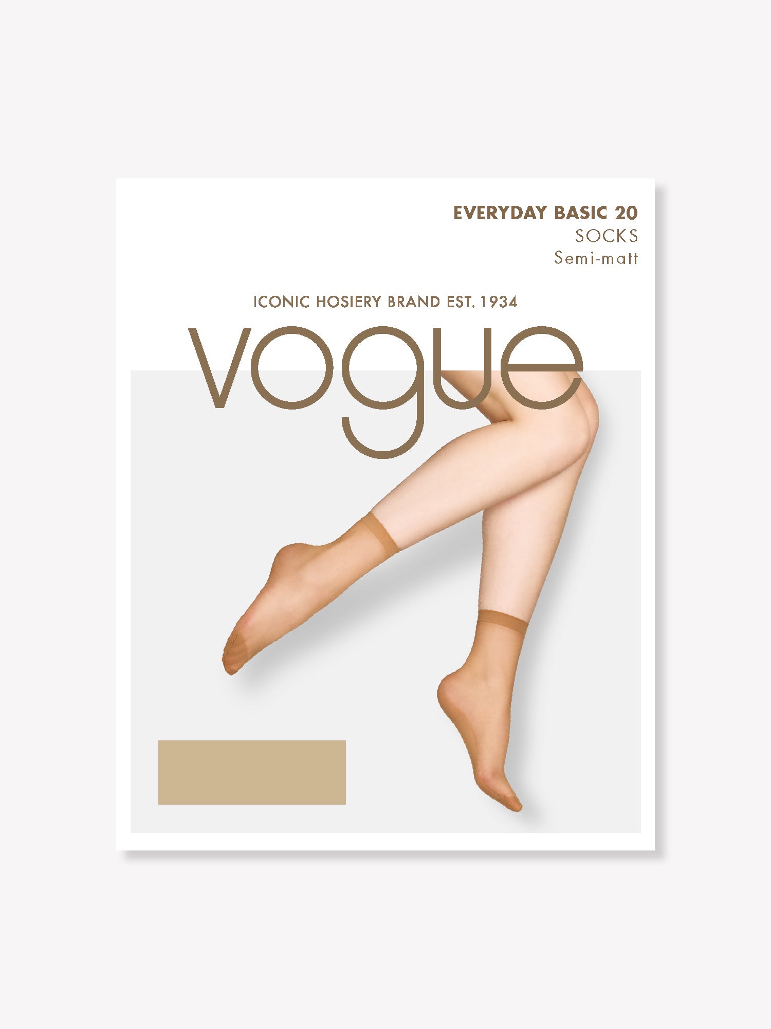 Vogue 20 denier ankle socks in shade Powder feature a semi-matte finish. Reinforced construction at the toe, sole, and heel ensures long-lasting wear. on a model pictured from the side. Product picture of the package.