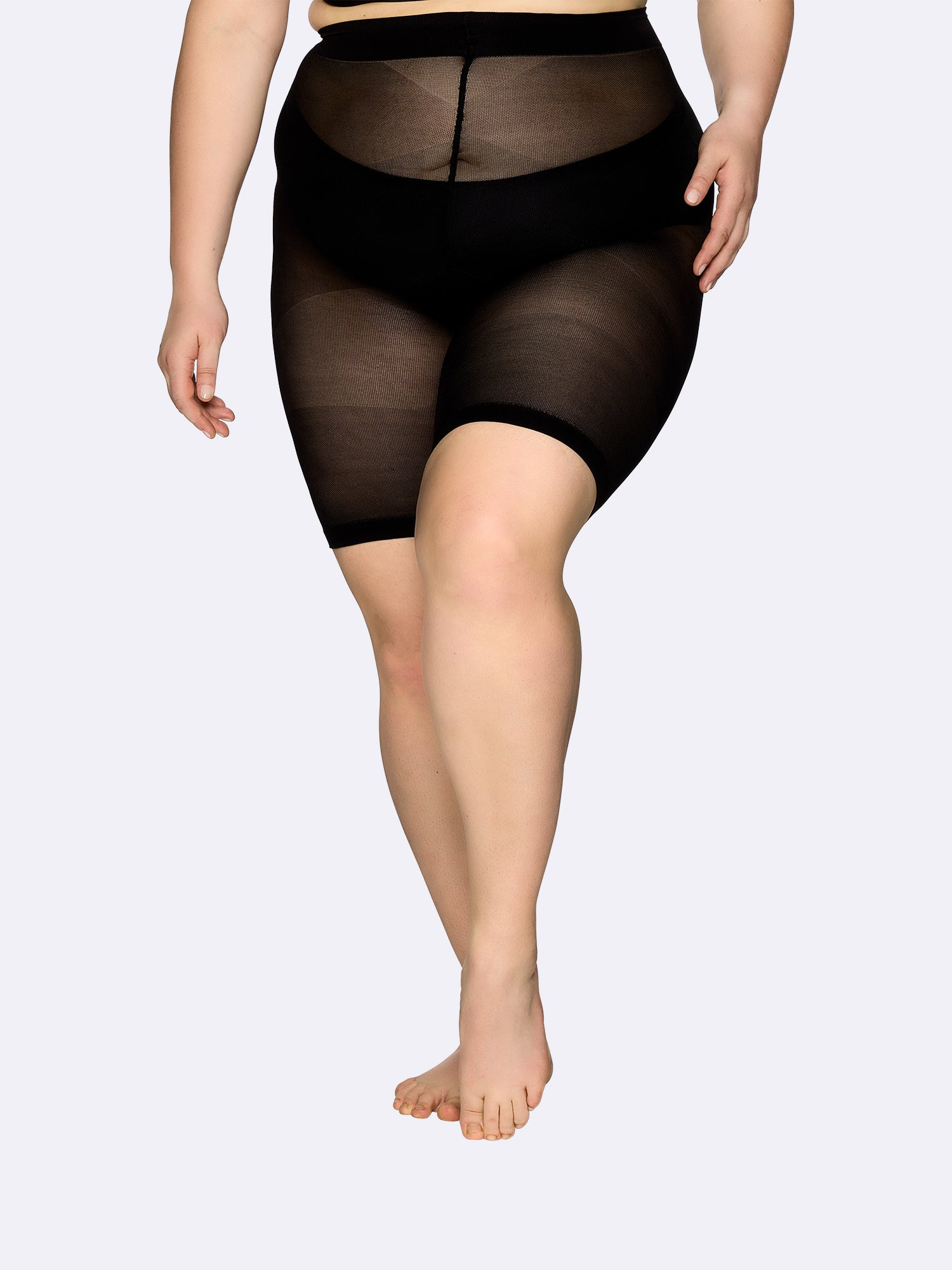Vogue women's Curvy Thigh Panty 40 denier short leggings in black are perfect for plus size women on model.