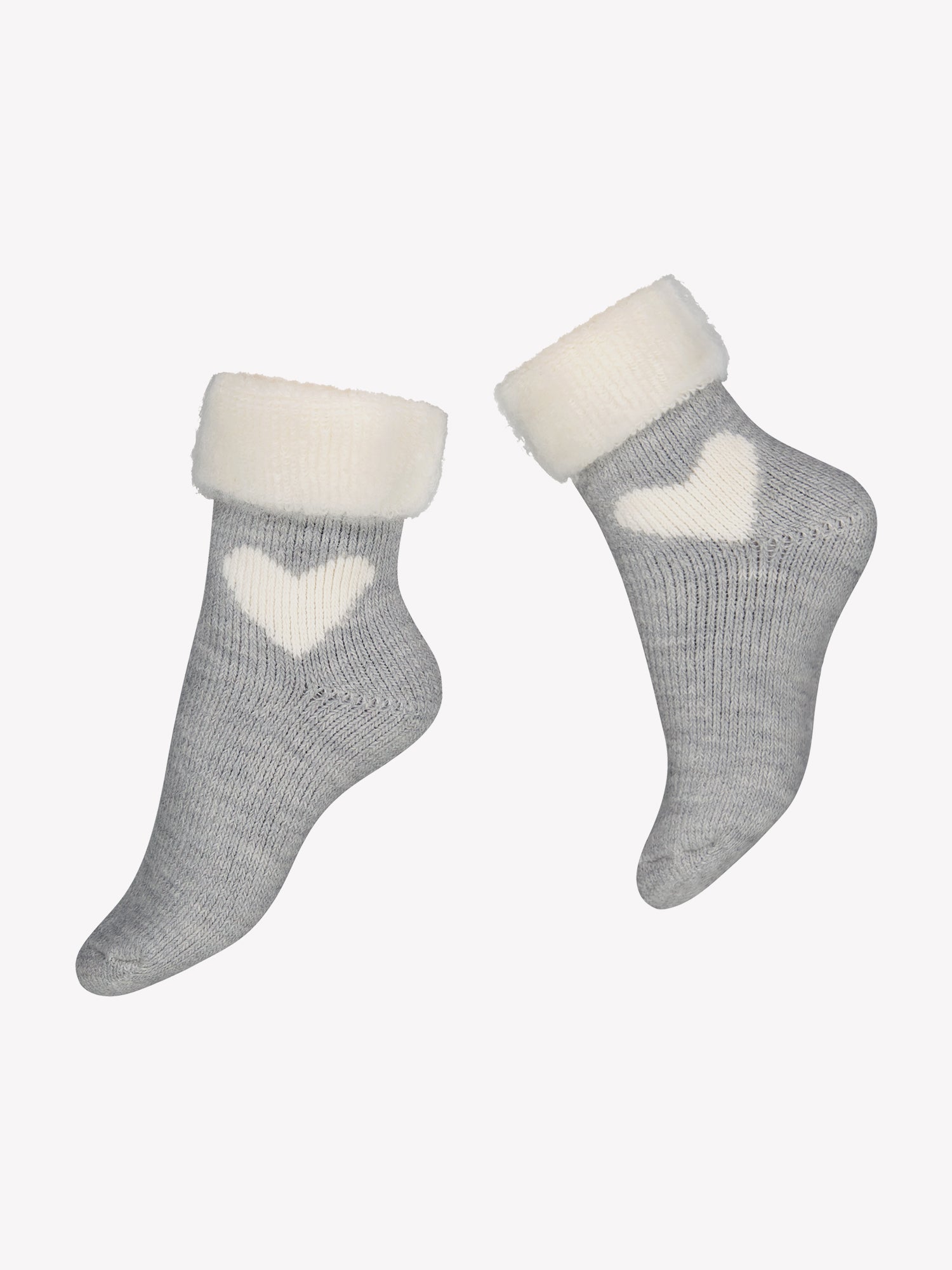 Vogue’s heather grey alpaca blend ankle socks feature a beautiful white heart pattern at the ankle in the product image. The wool blend includes alpaca, and the inside is brushed for a soft, fluffy feel.