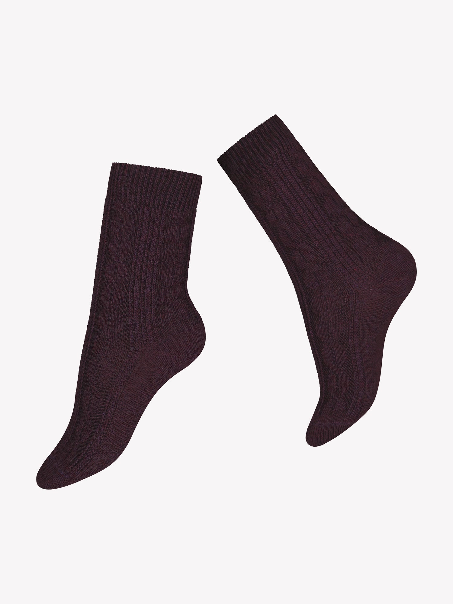 Olivia wool blend socks with cashmere and classic cable pattern in a dark burgundy color in a product picture.