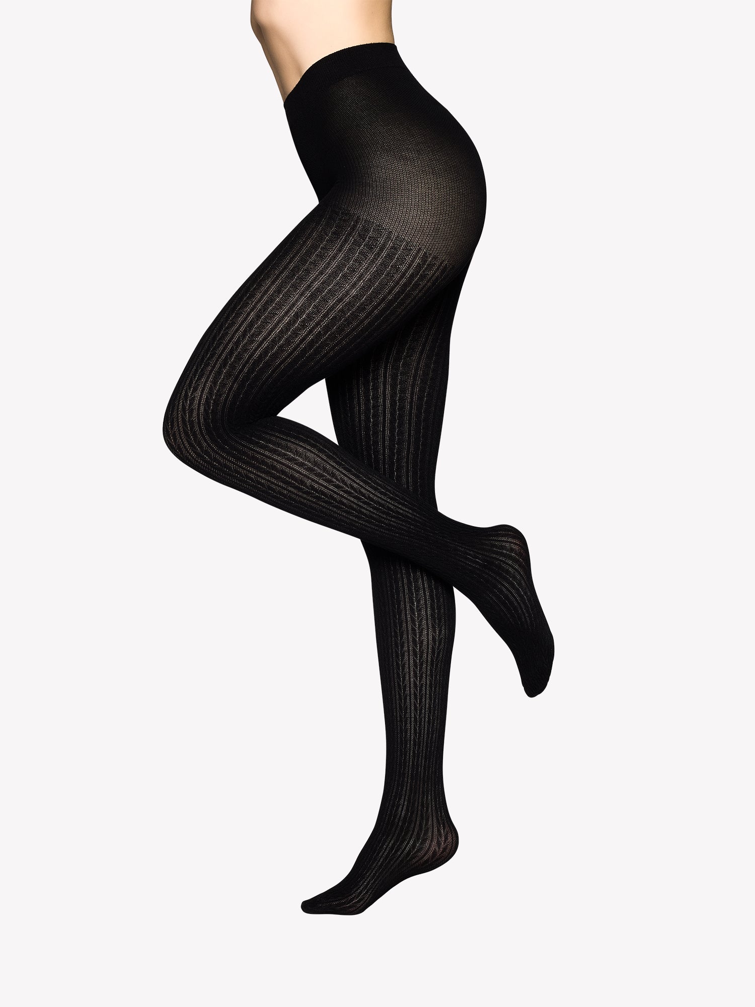 Vogue’s black Ellen viscose tights with a  cable knit pattern in a product picture.