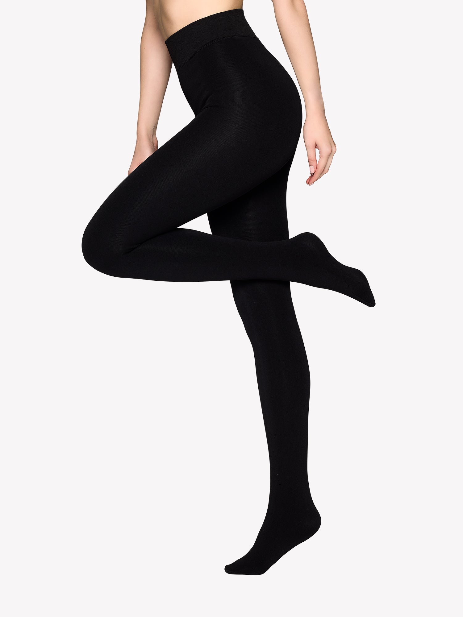 Vogue's black tights on a model.
