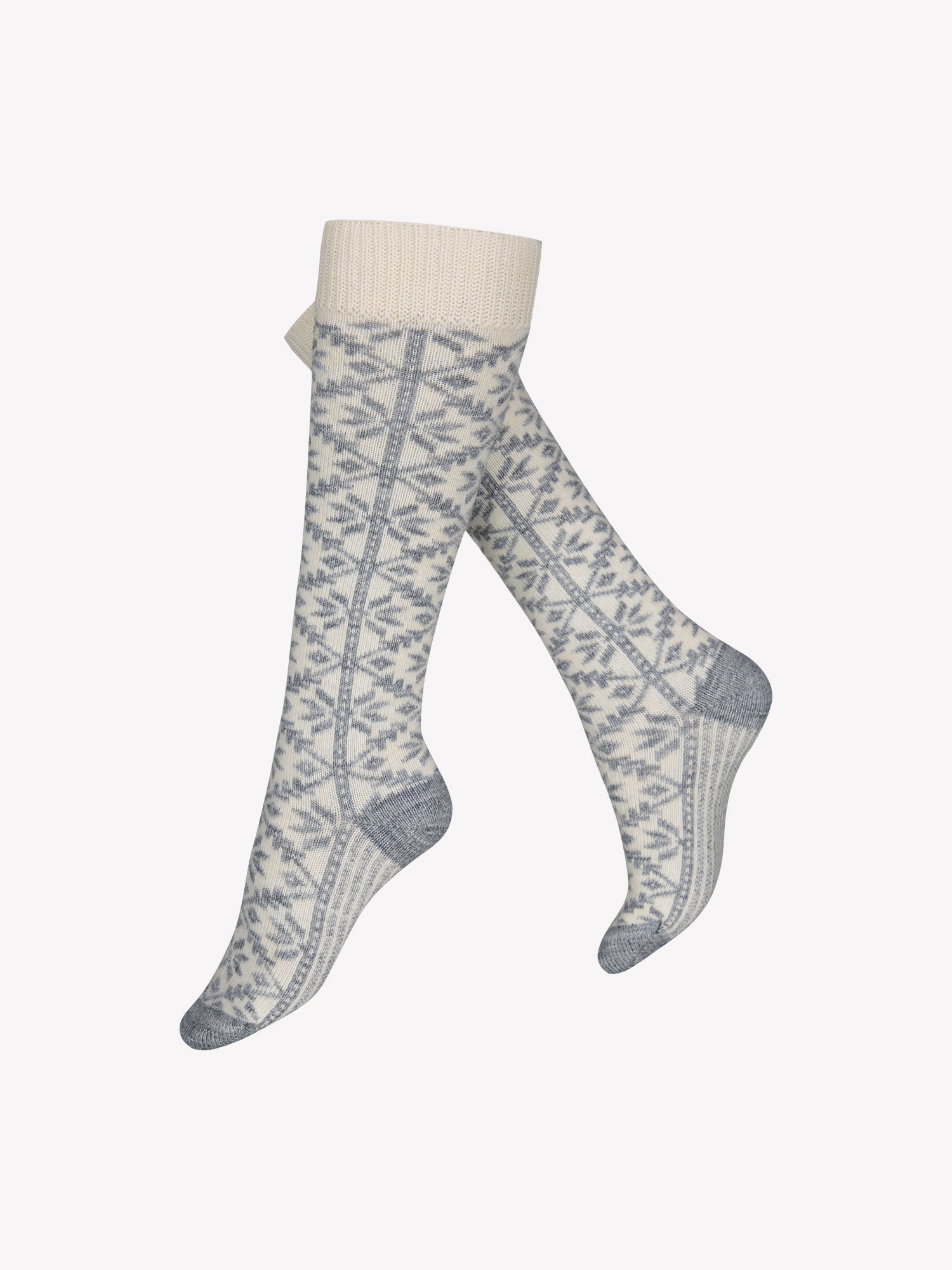 Vogue's off-white knee high socks from wool blend in a product picture. A grey fair isla pattern gives the finishing touch to the socks. 
