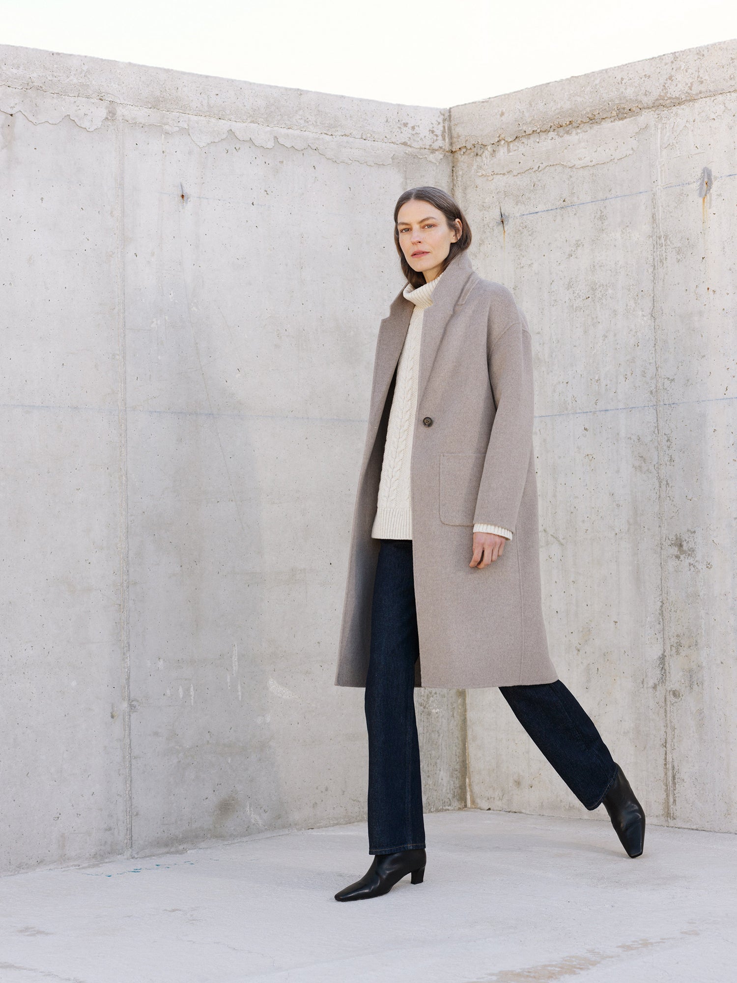 Nanso women's stylish and timeless beige YLLE wool coat. On a model from the front