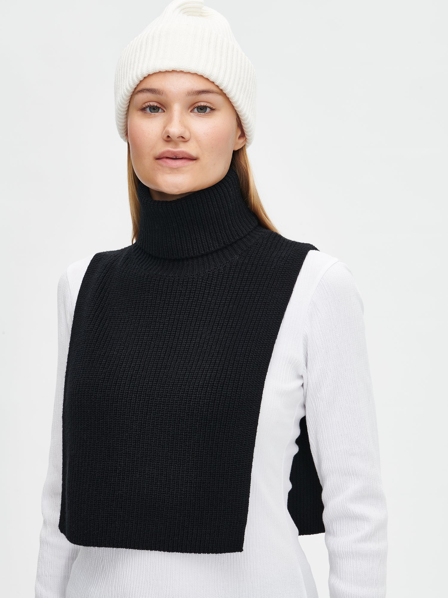 Women's black Utu turtle scarf is crafted from a comfortable patent knit and features a foldable turtle collar. Front