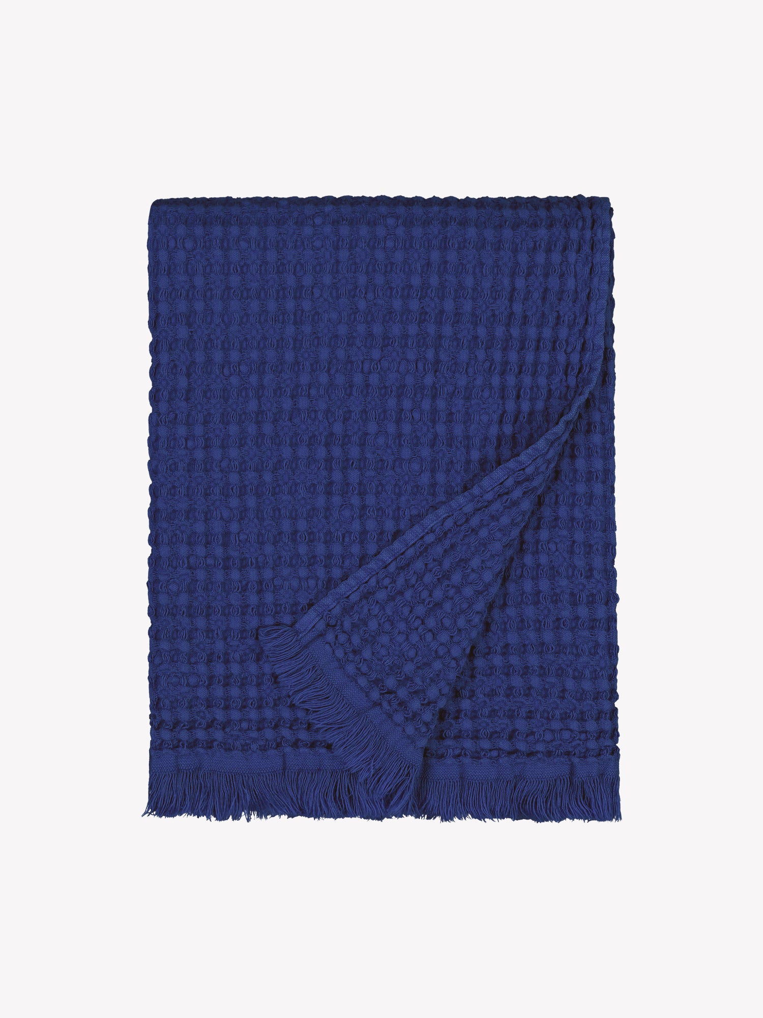 Nanso home's Vohveli Bath towel in blue folded