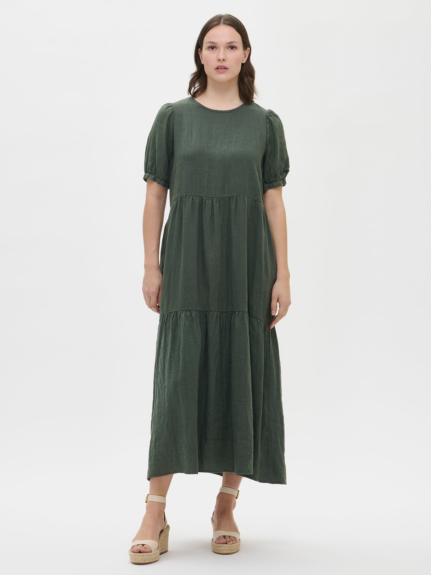 Nanso women's beautiful Sarastus maxi linen dress in dark green features voluminous frill layers and short puffed sleeves from the front