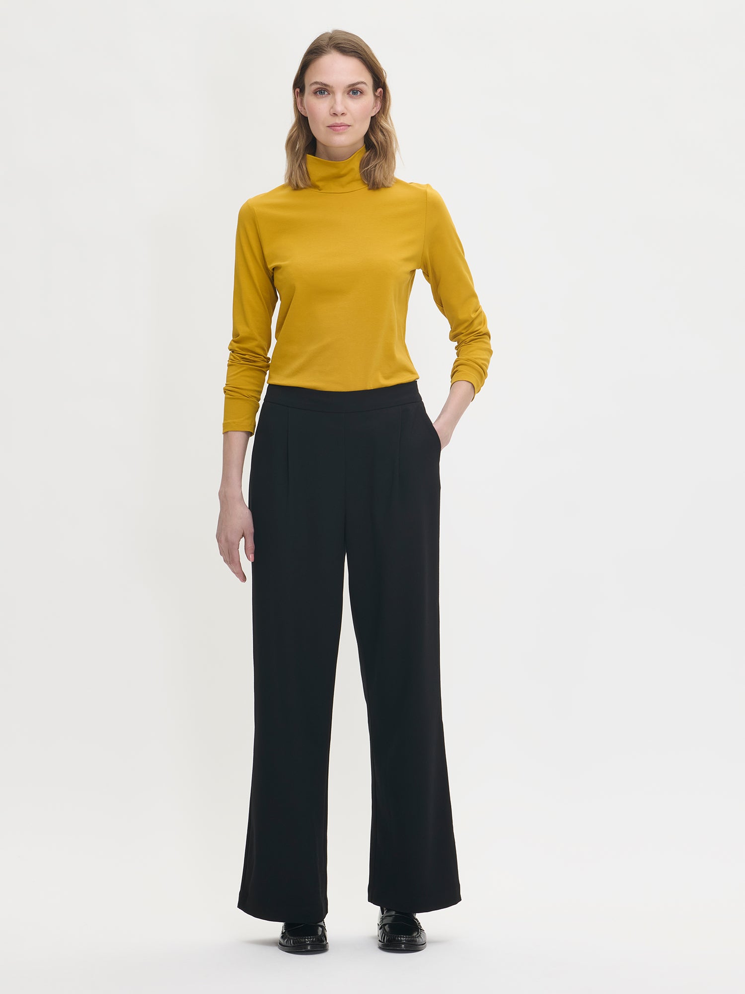 Women's Mari jersey turtleneck in yellow with black trousers