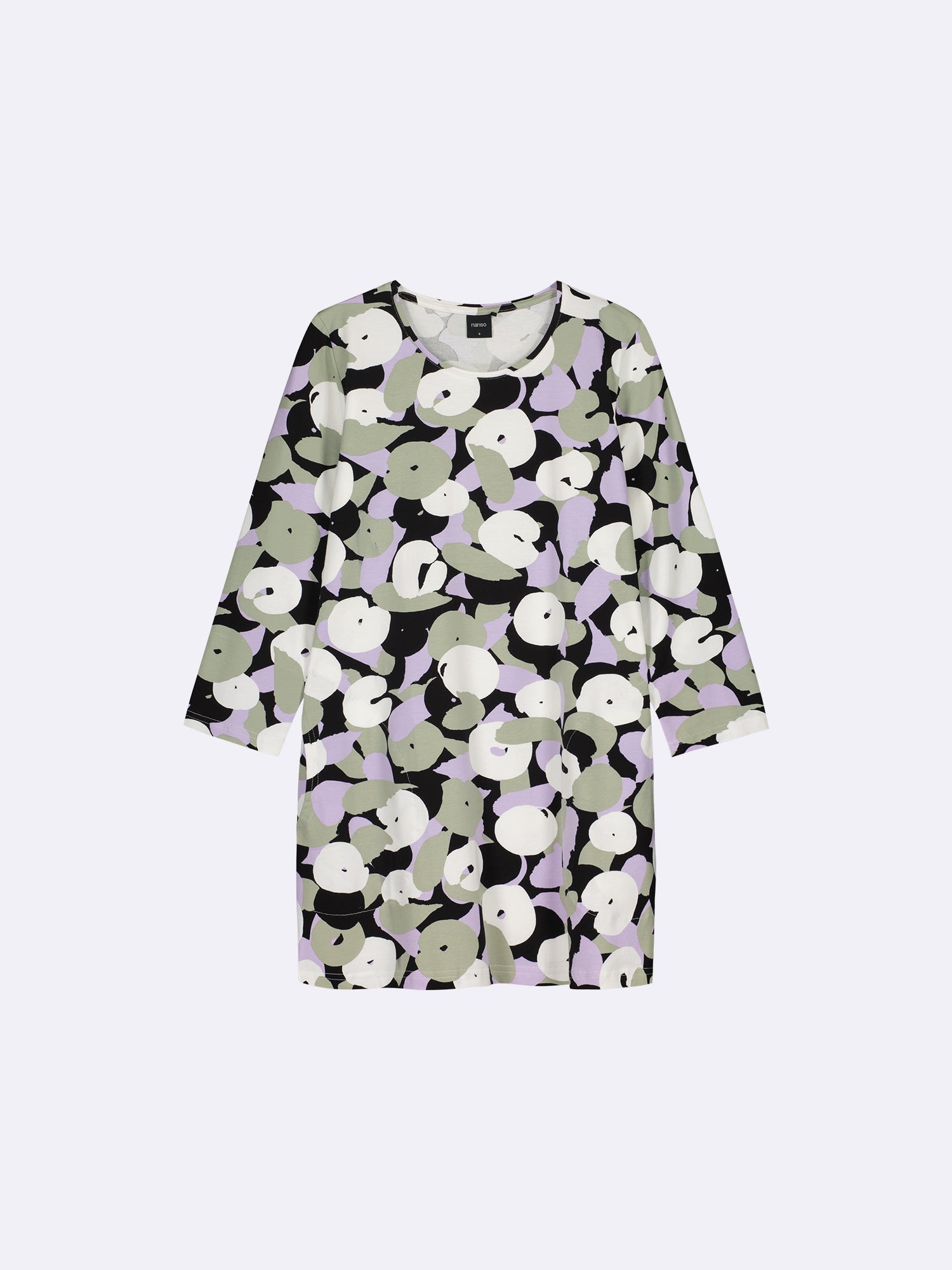 Women's patterned Perenna tunic in olive green. The cozy tunic features a neatly finished round neckline with piping, side pockets, and 3/4-length sleeves. 