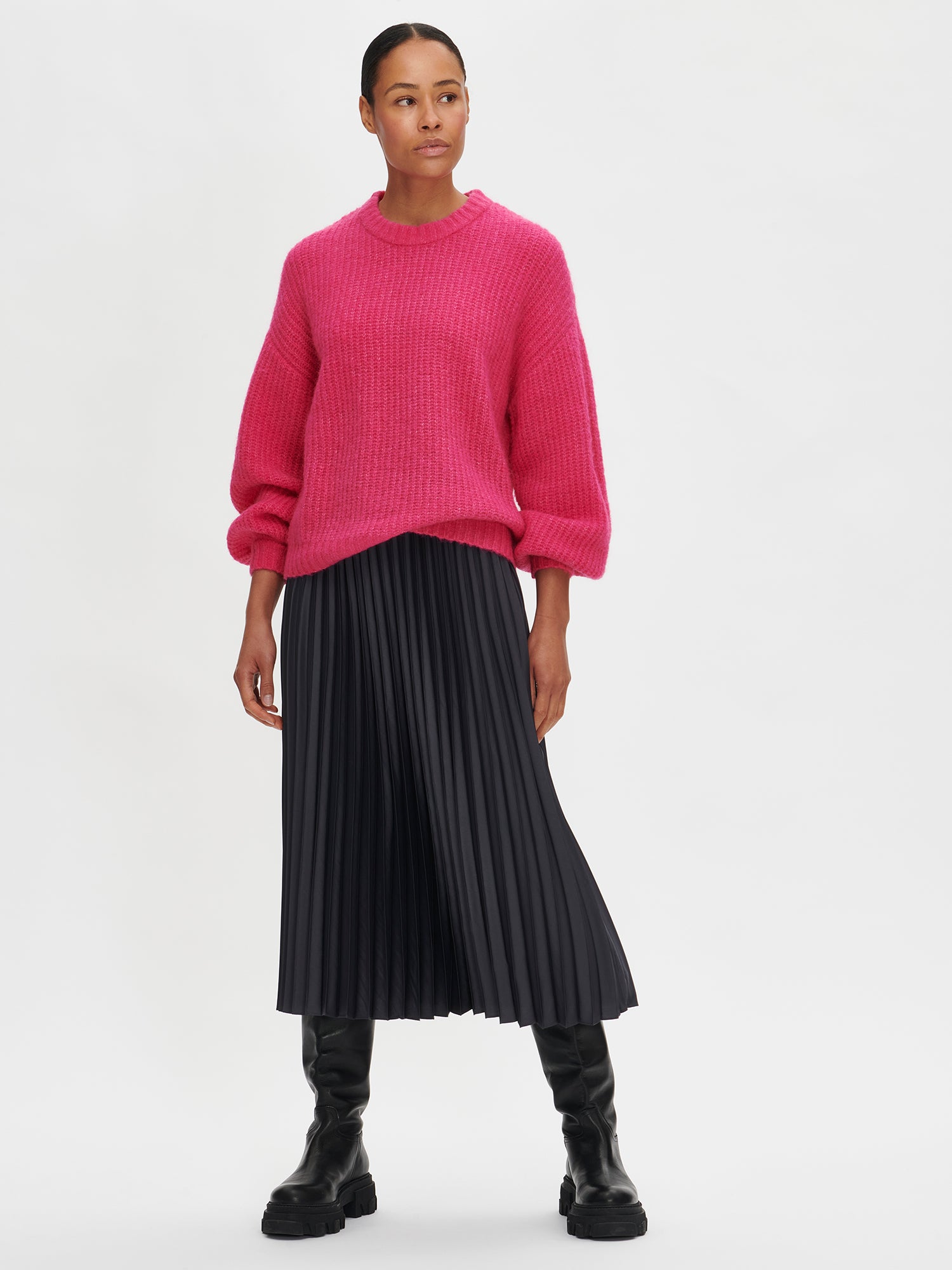 Nanso's elegant Taite skirt for women features a graceful drape in grey shade, on a model