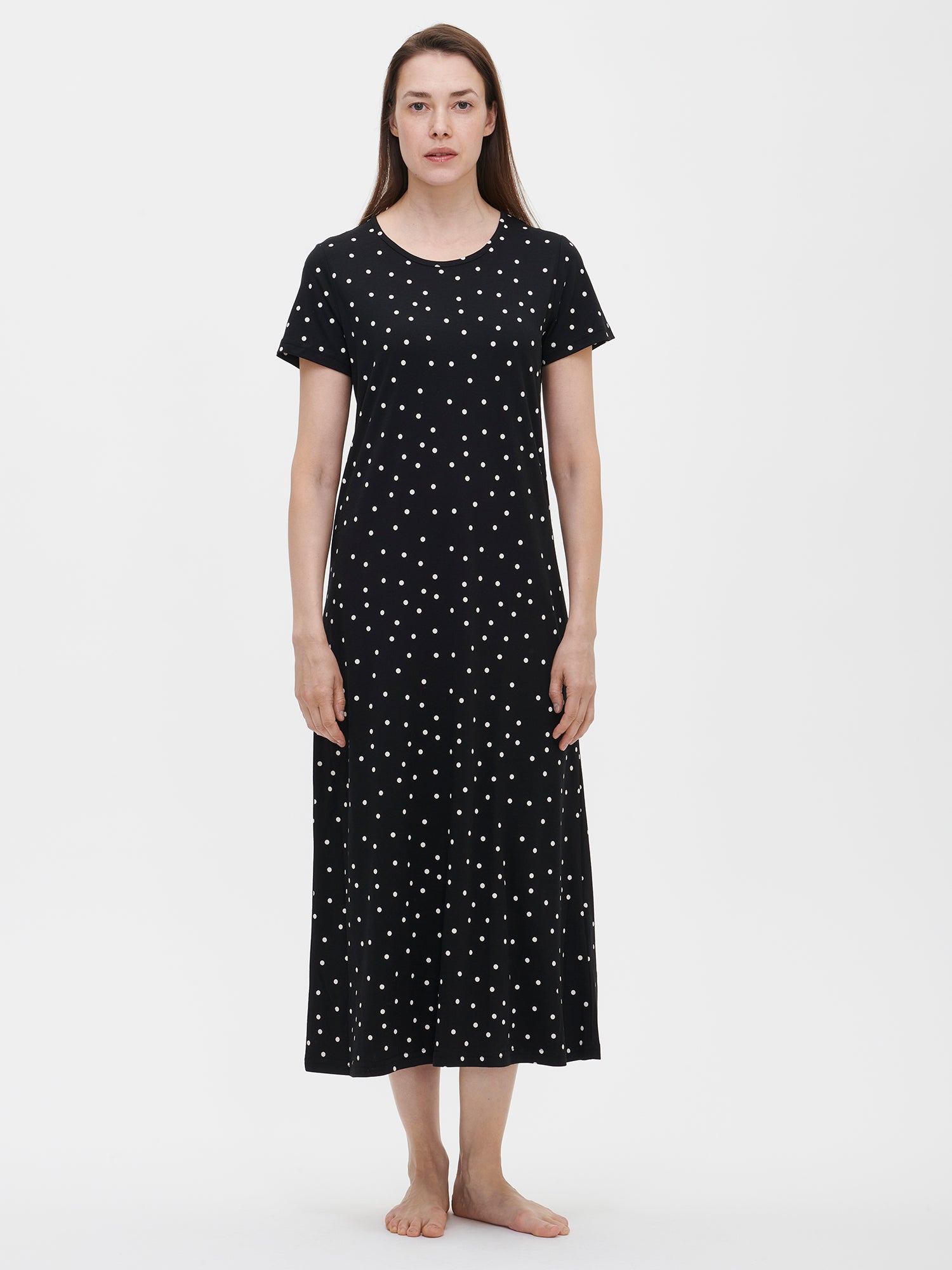 Nanso women's patterned black Pallo nightgown with short sleeves and a round neckline, worn by the model.