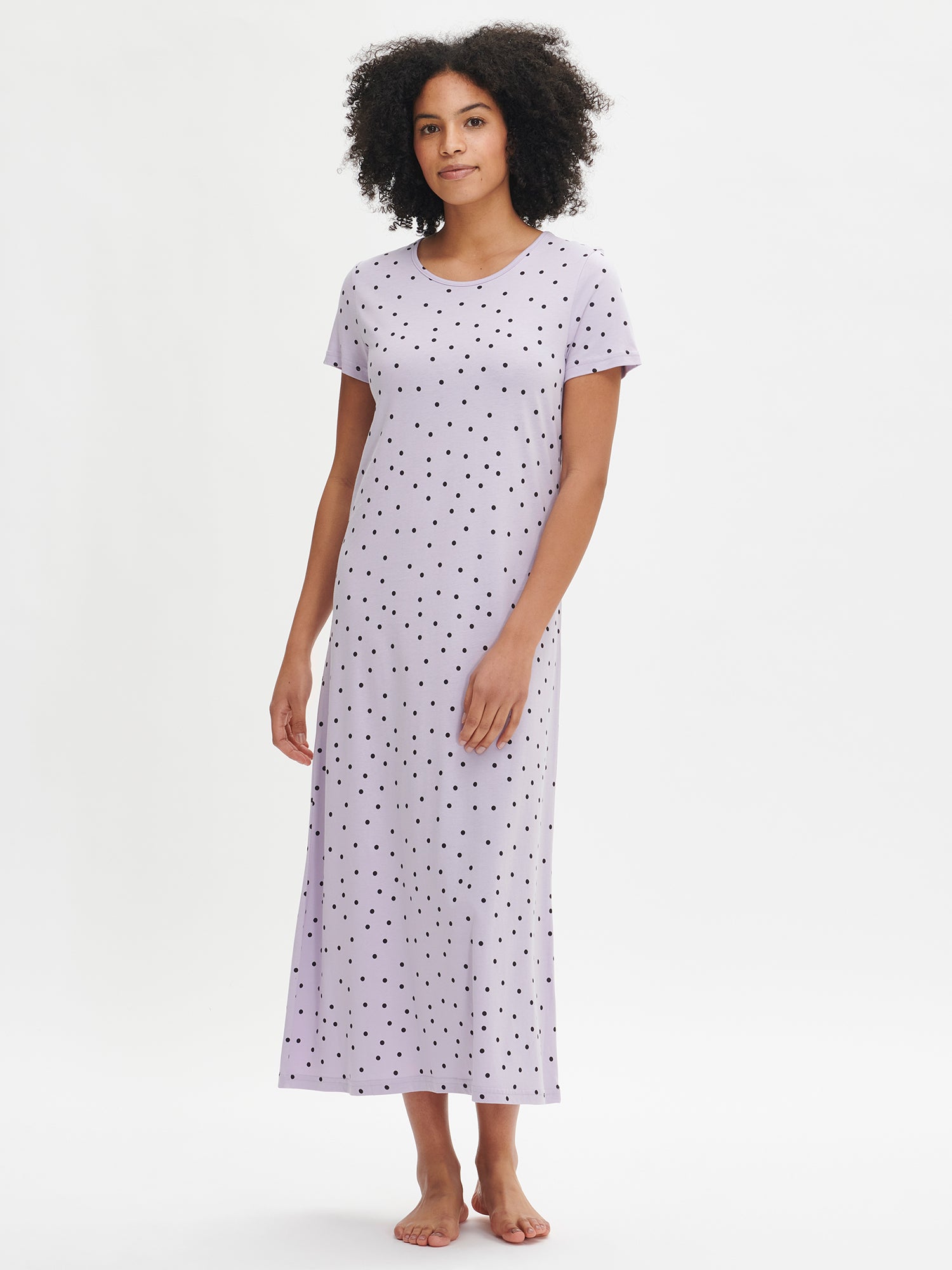 Nanso women's patterned violet Pallo nightdress with short sleeves and a round neckline, worn by the model in a front view.