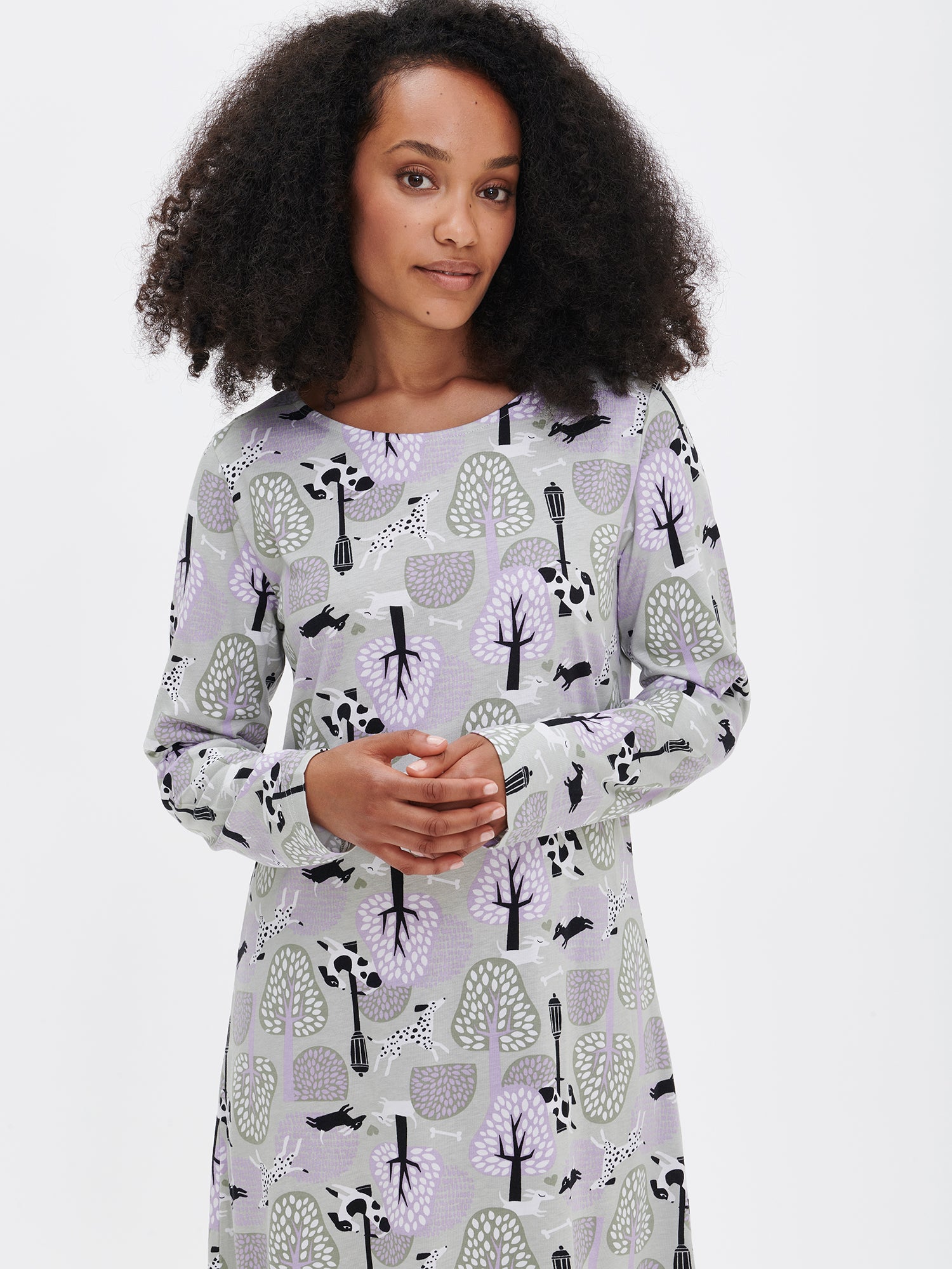 Nanson women's patterned green Luna nightdress with long sleeves and an oval neckline, worn by the model in a close-up front view.