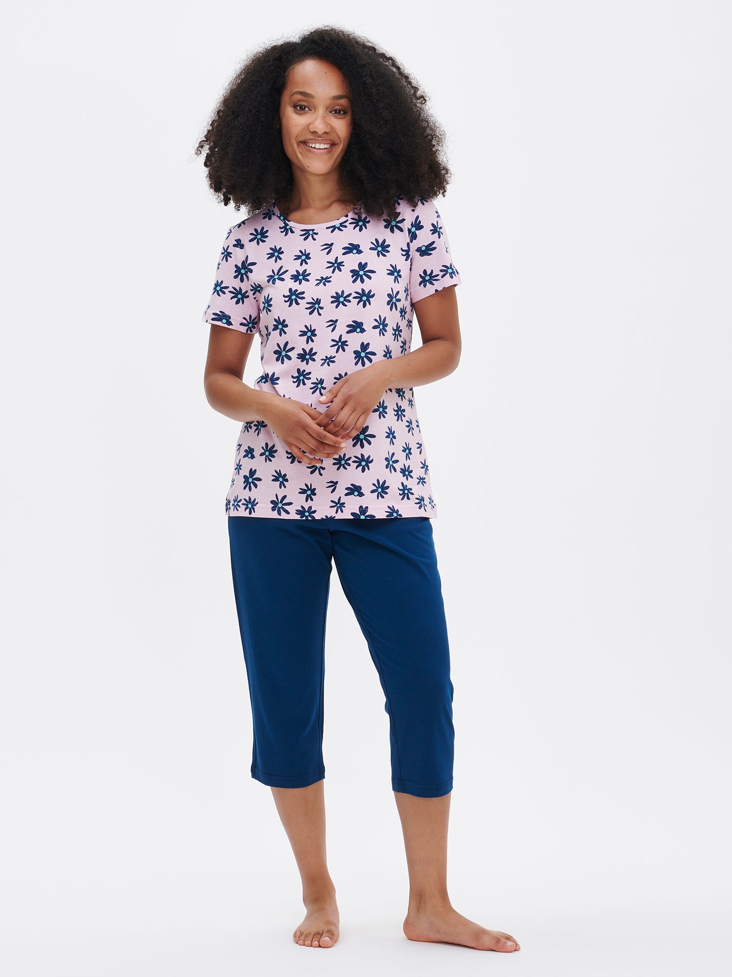 Nanson women's patterned pink Marketta pajamas with short sleeves and solid-colored 3/4-length pants, worn by the model.