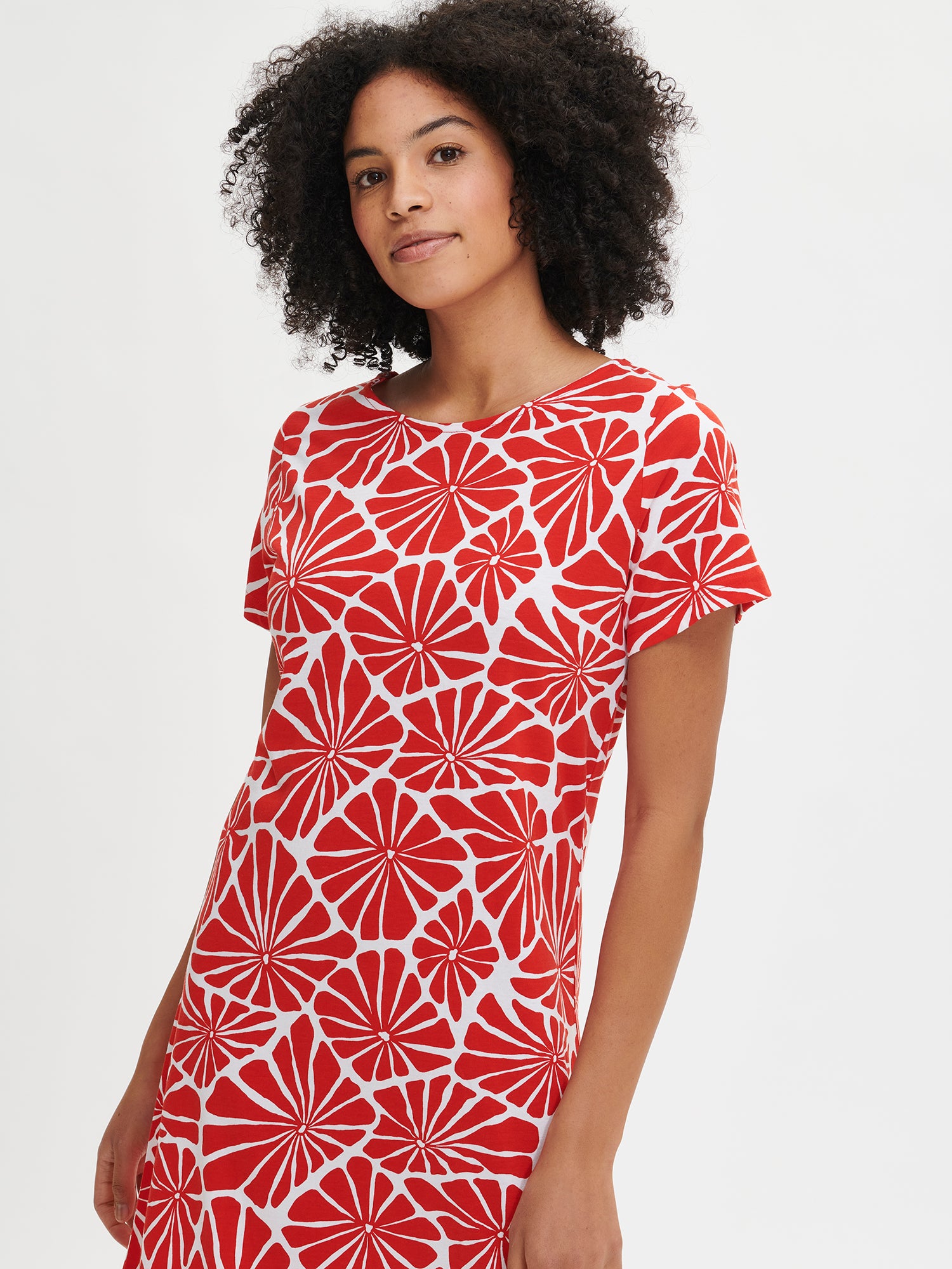 Nanson women's patterned red Aralia nightdress with short sleeves and an oval neckline, worn by the model in a close-up front view.