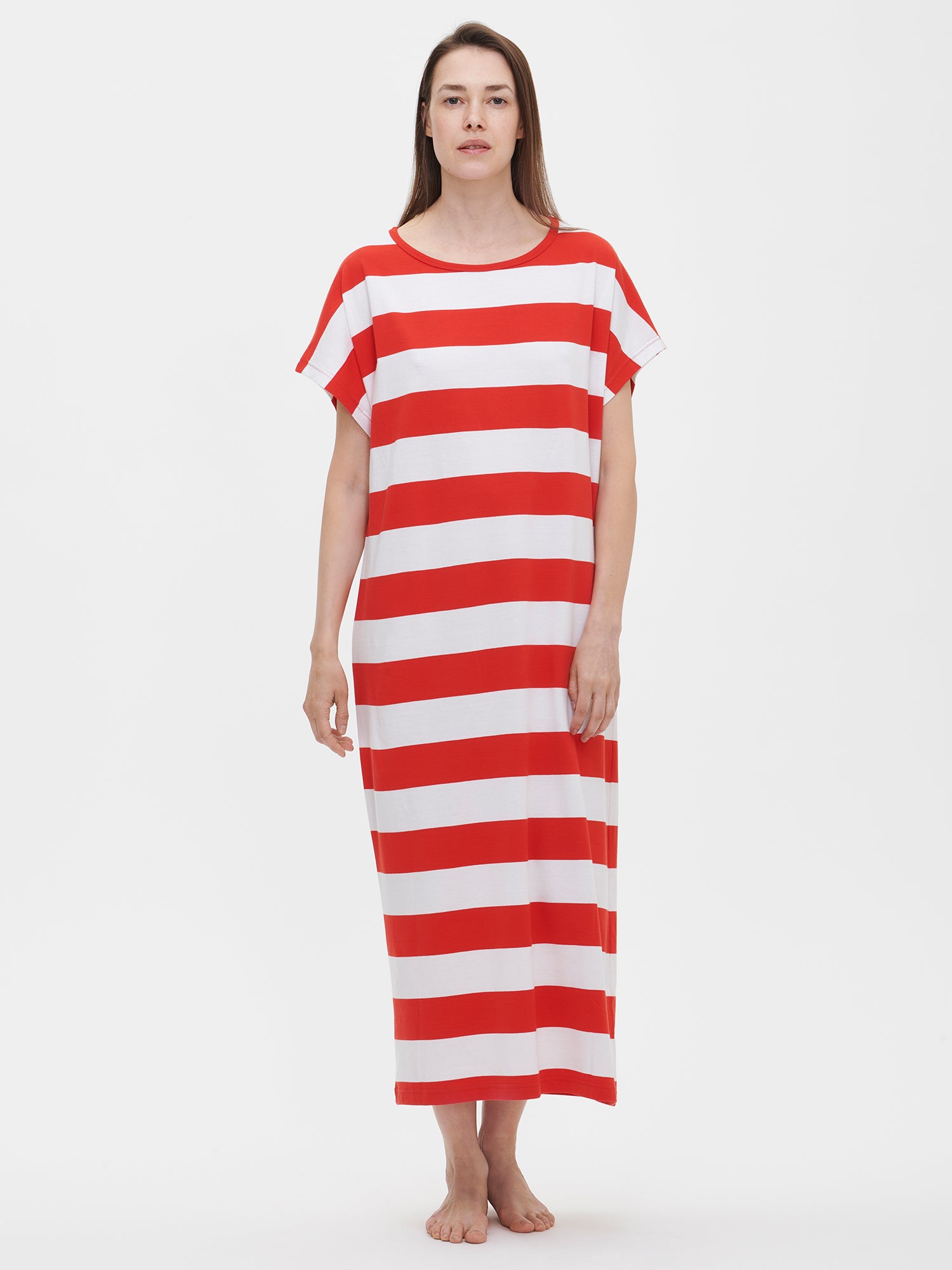 Nanson women's red striped Palkki kaftan with an oval neckline, dolman sleeves, side pockets, and long side slits, worn by the model.
