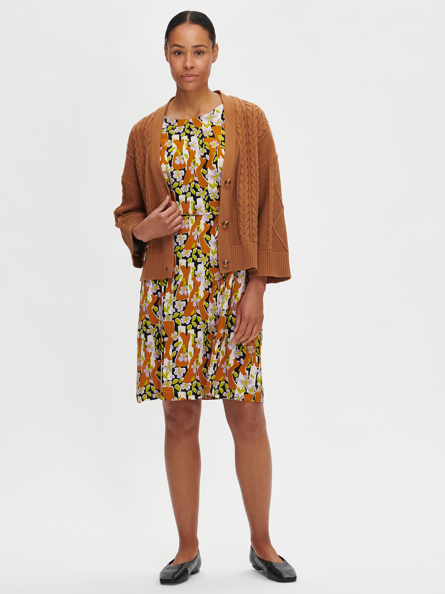 Nanso's Coletta women's knit cardigan in brown with a dress