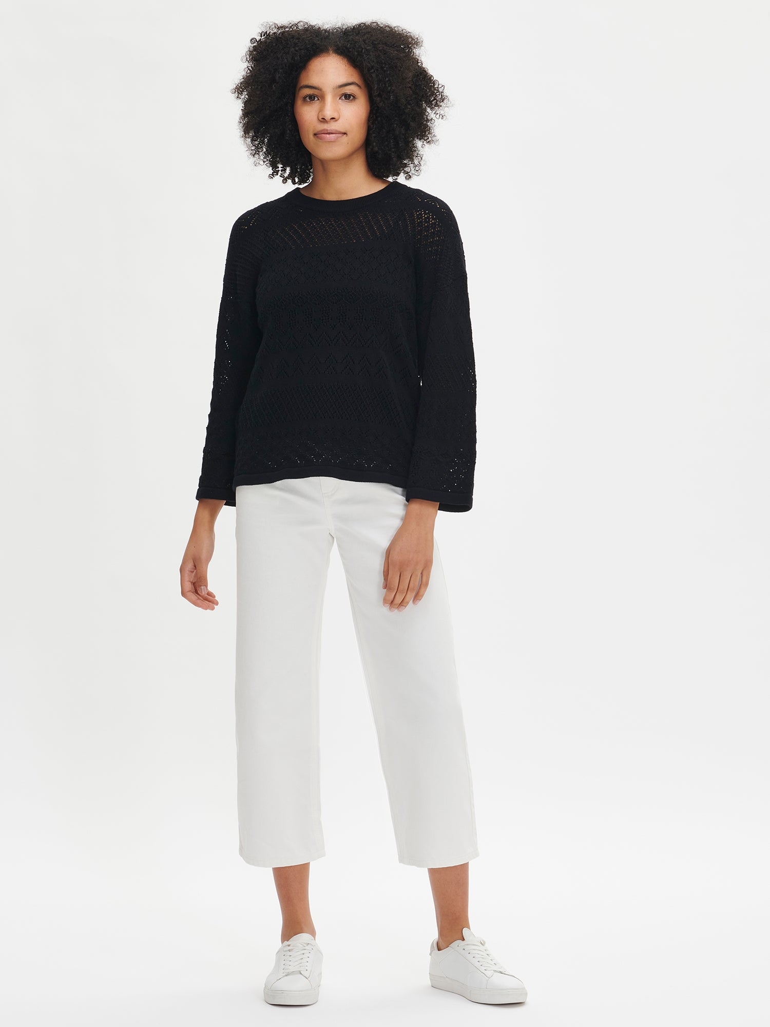 Nanso's Palermo knit sweater for women in classic black with white trousers