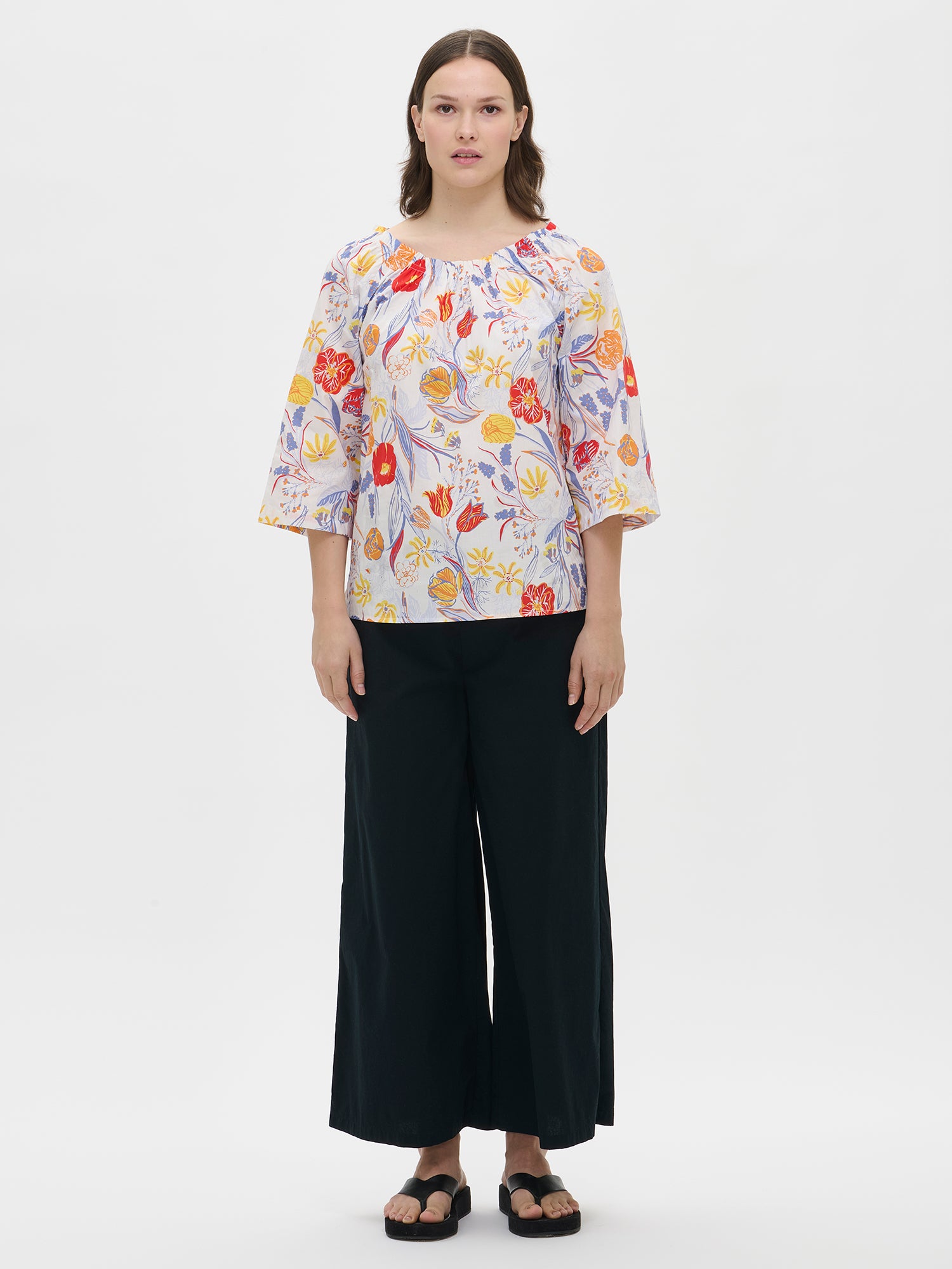 Nanso's multicoloured Floristi blouse for women features a beautiful floral pattern, styled with black pants