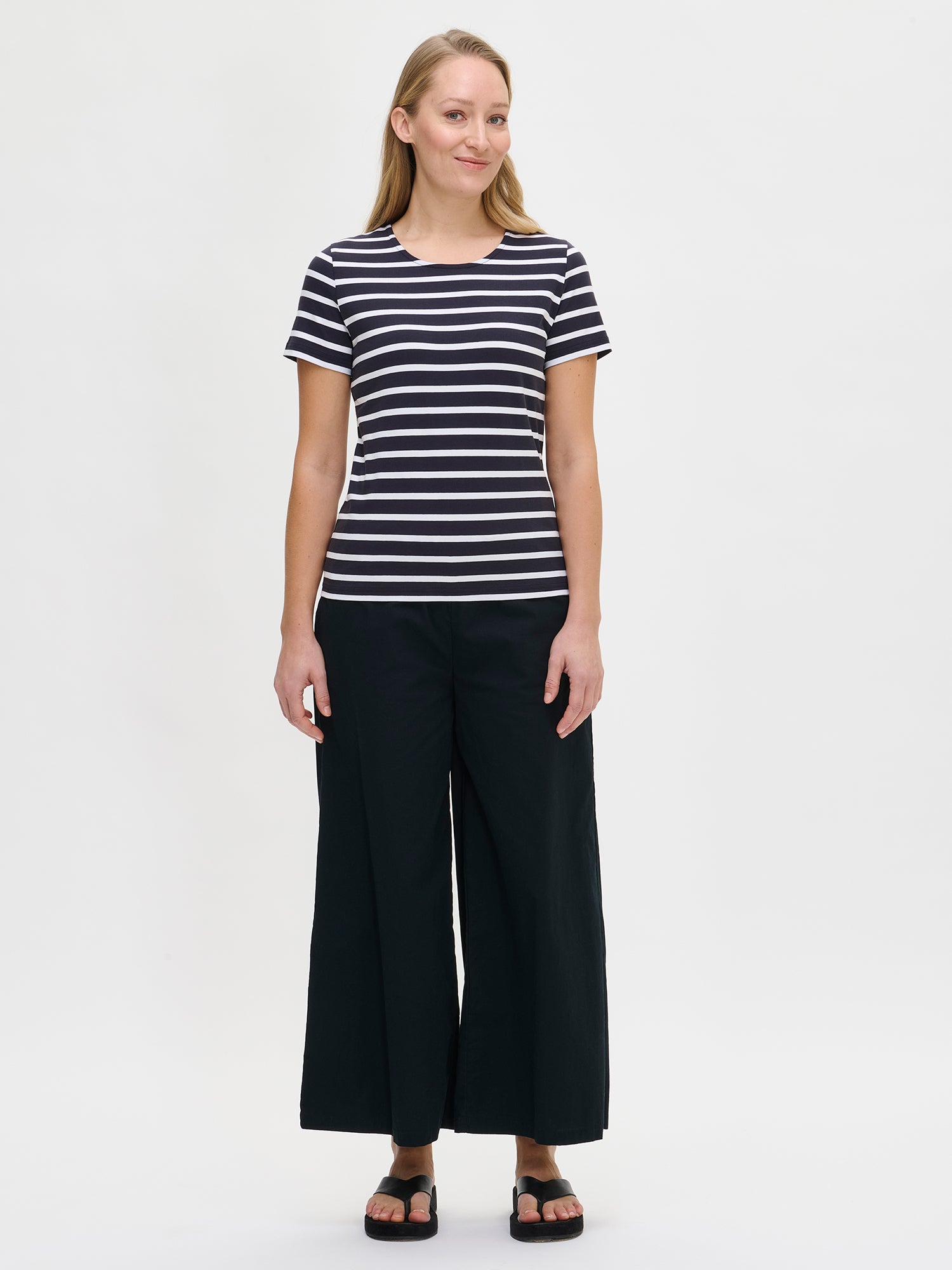 Nanso women's dark blue striped Marianne t-shirt, with a wide round neckline finished with binding and short sleeves, shown on the model.