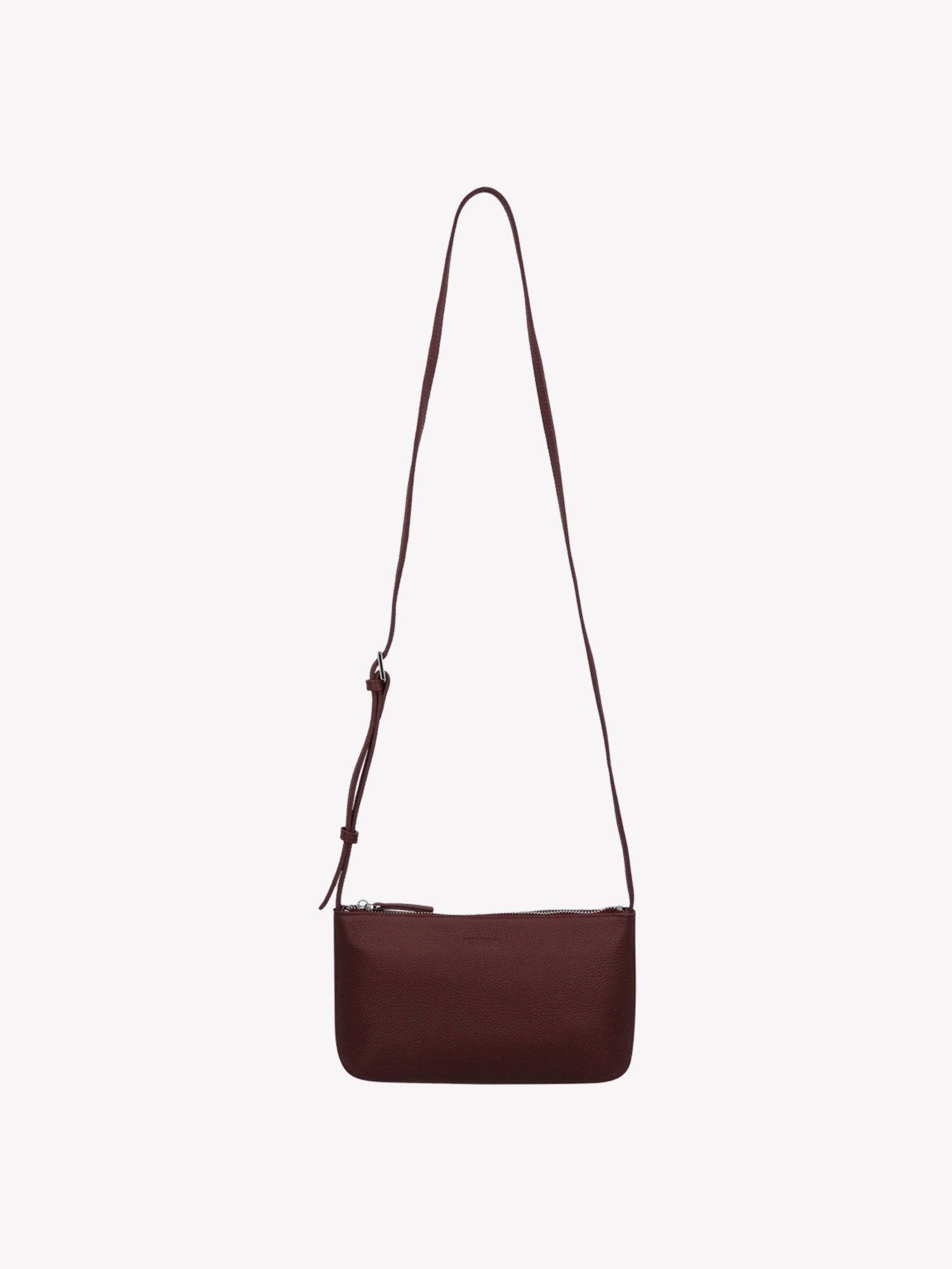Nanso sleek burgundy Naru leather bag comes with a long, adjustable shoulder strap and a secure zip closure