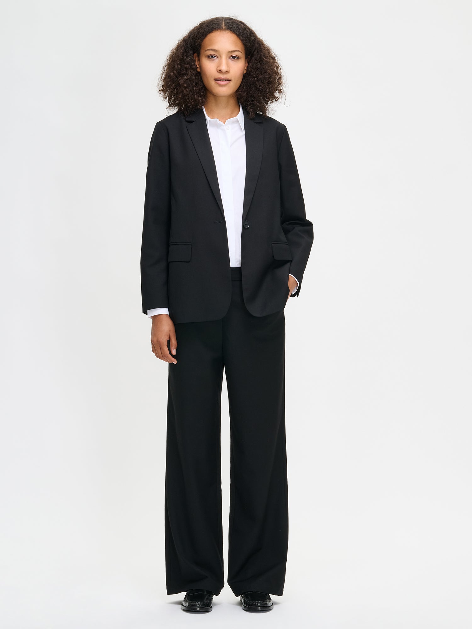 Nanso women's black Bea trousers on a model