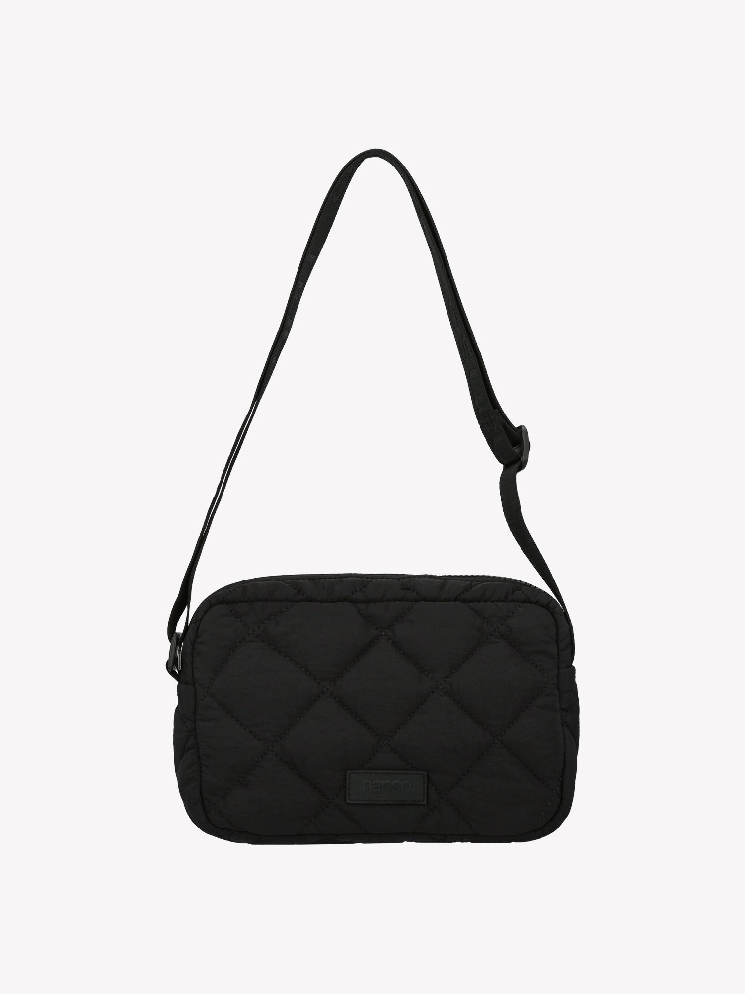 Nanso's stylish Vanu bag in black features quilted fabric and an adjustable shoulder strap, front