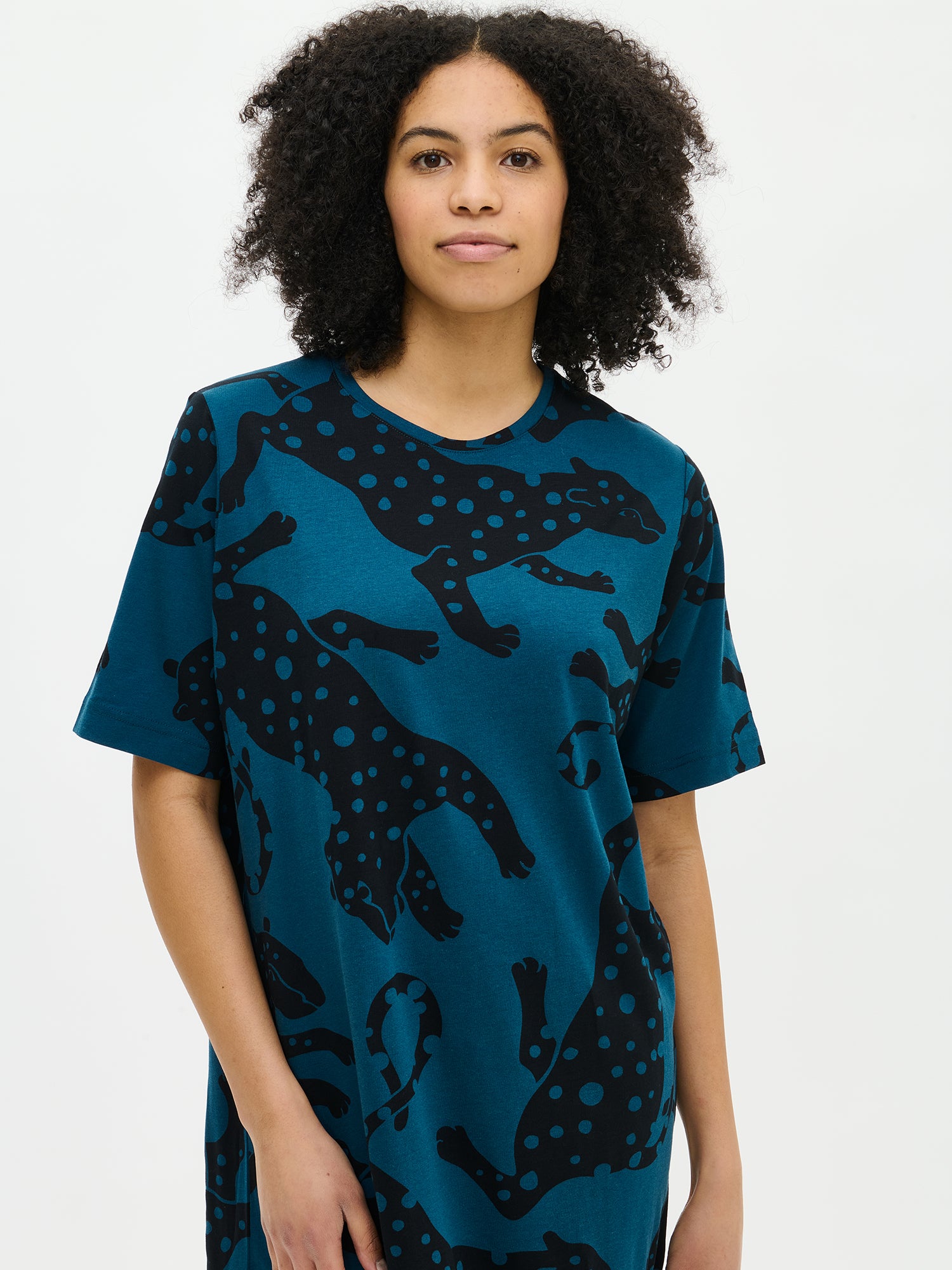Nanso women’s blue patterned Leonora nightgown with round neckline and elbow-length sleeves, worn by model in close-up.